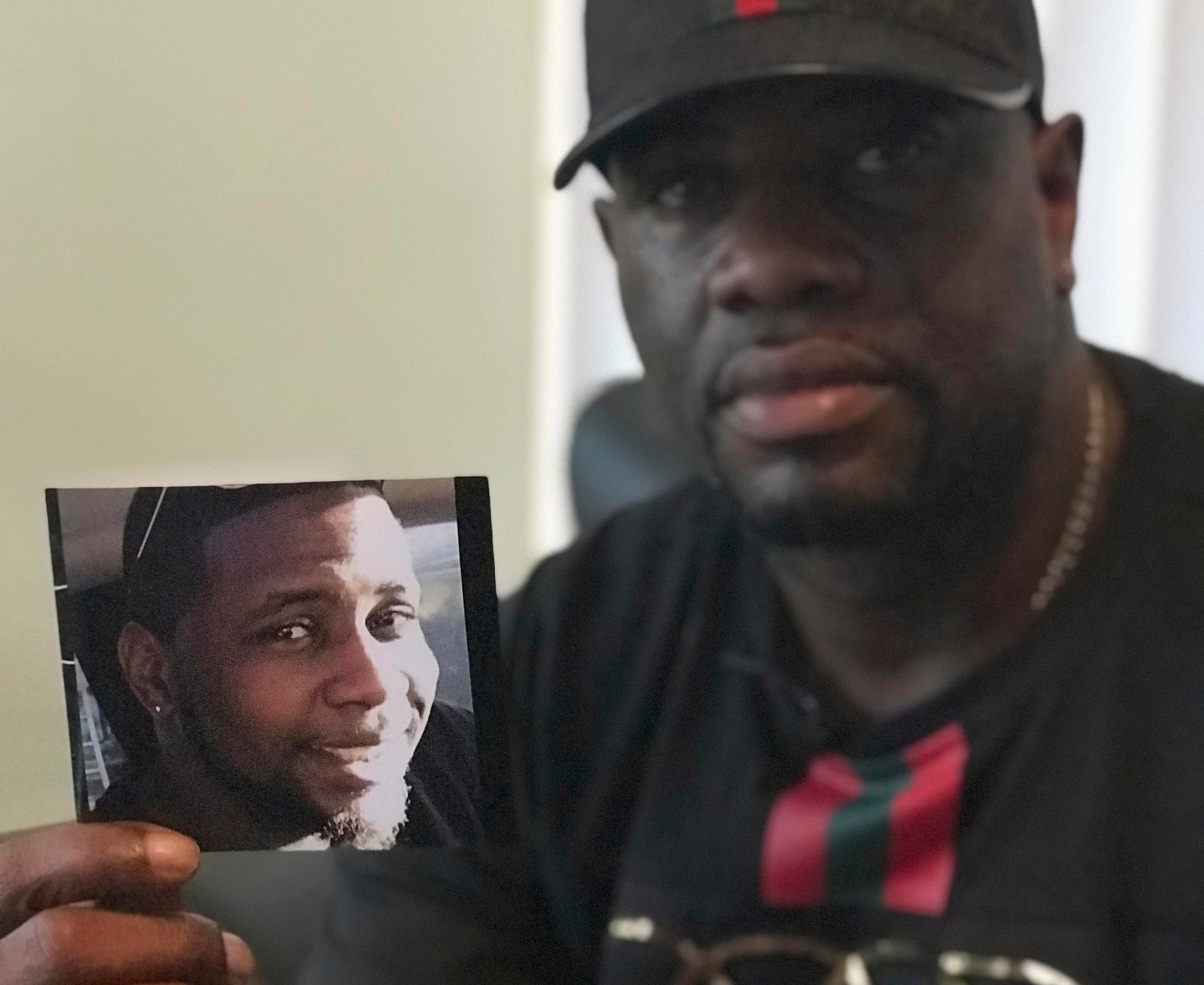 McGlockton with a photograph of his son, Markeis, in Florida