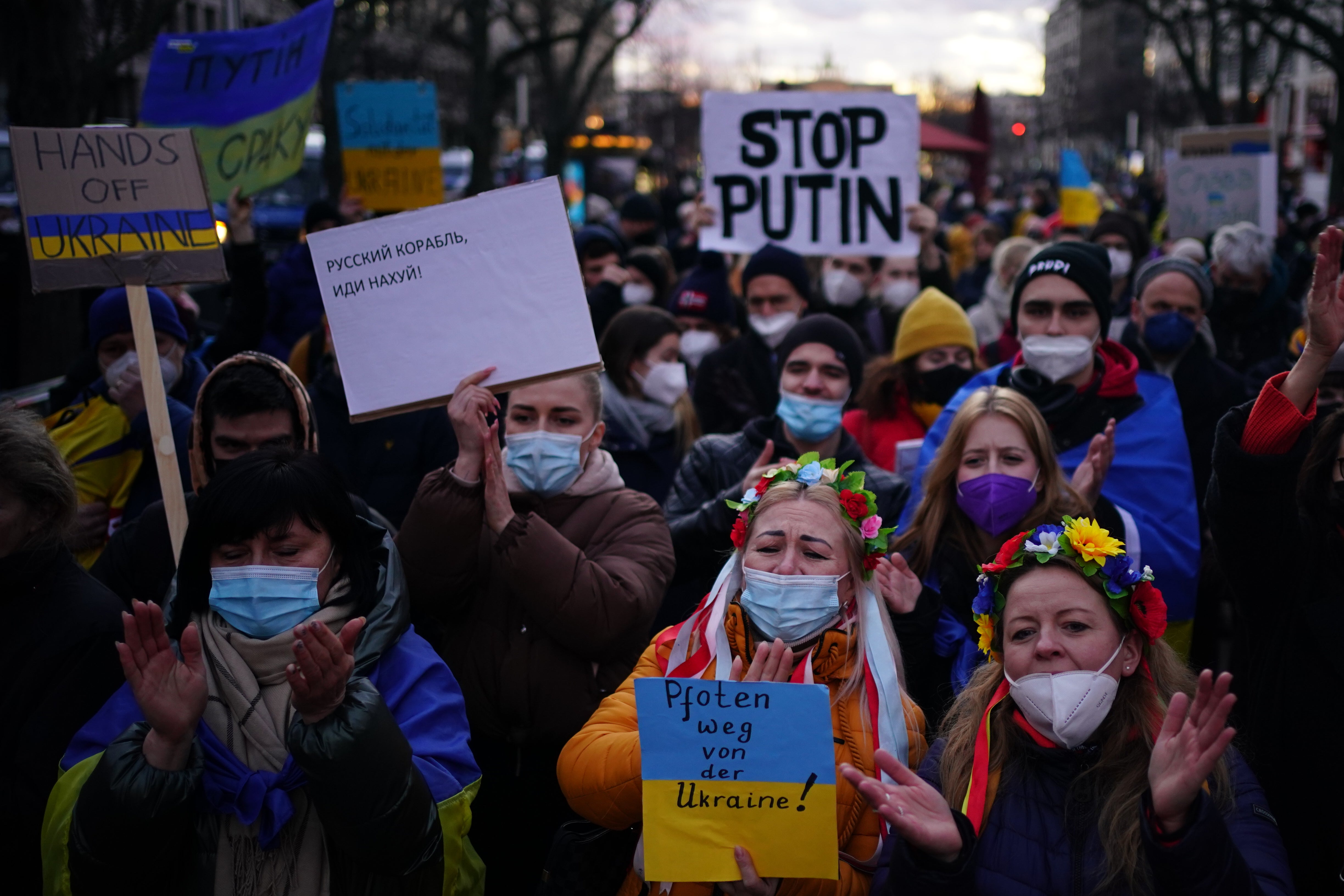 Ukrainian supporters cheer in front of the Russian embassy in Berlin on Saturday