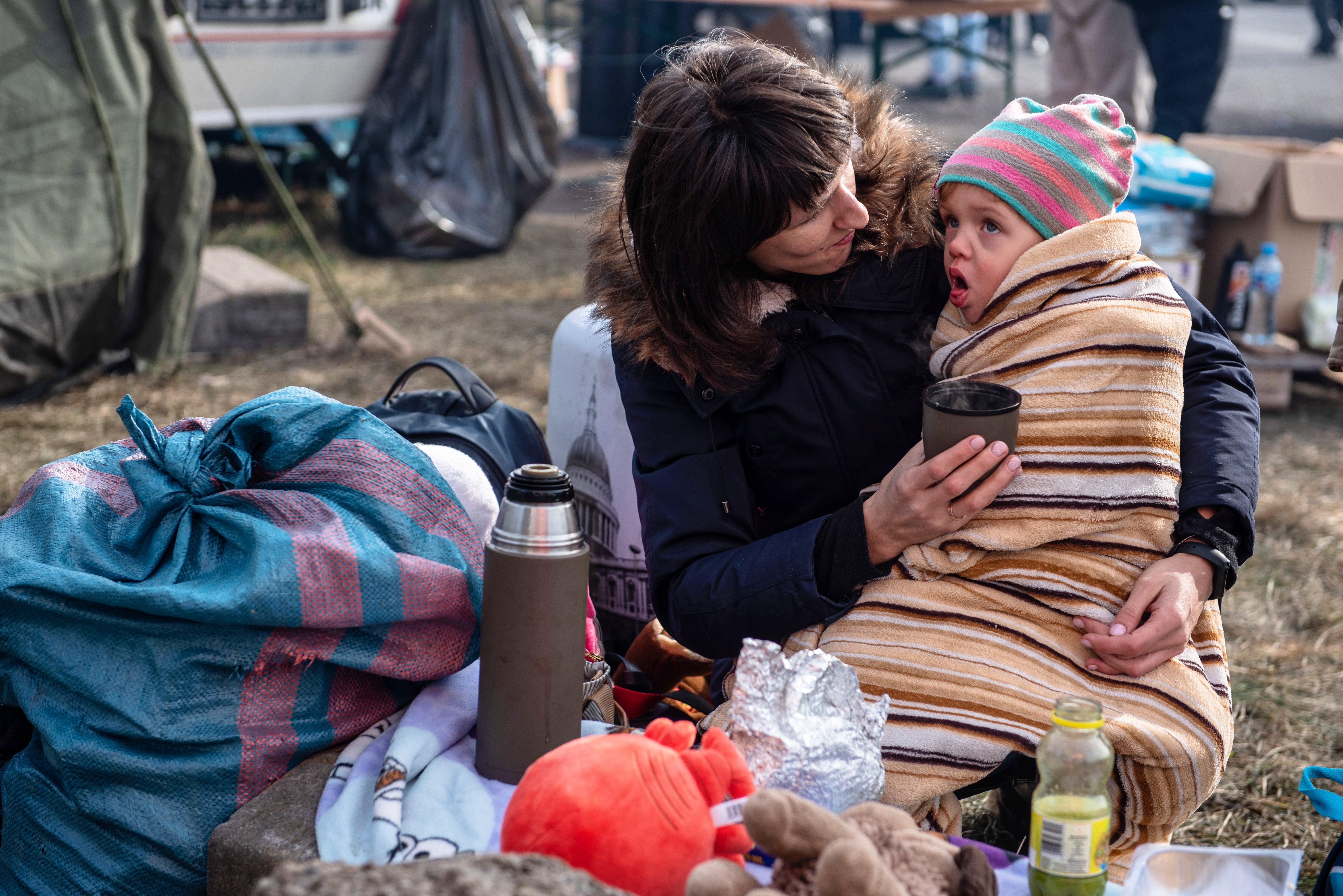 A mother and child near the Polish-Ukrainian border in Hrebenne, Poland