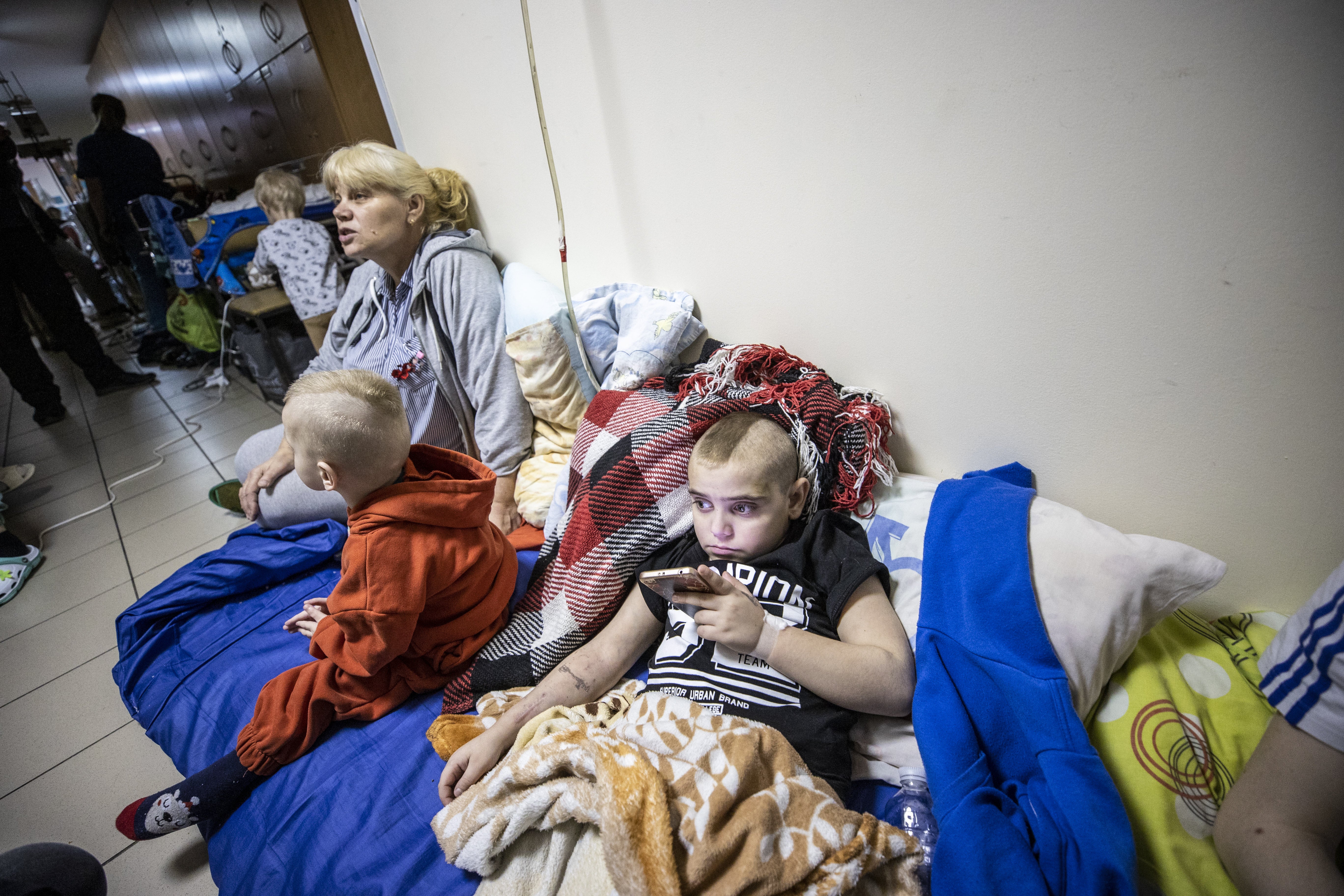 Children including those diagnosed with cancer receiving treatment are seen as they were moved to the basement floor or the shelter of Okhmatdyt Children’s Hospital