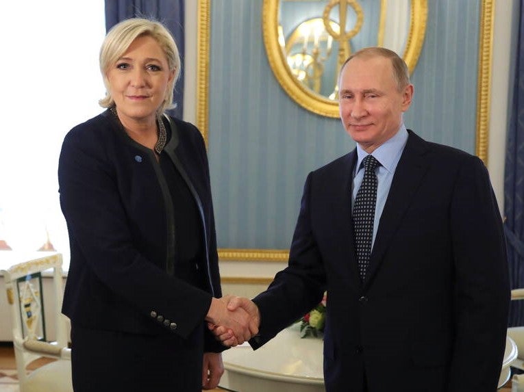 Russian President Vladimir Putin shakes hands with Marine Le Pen, French National Front (FN) political party leader, during their meeting in Moscow, Russia 24 March, 2017