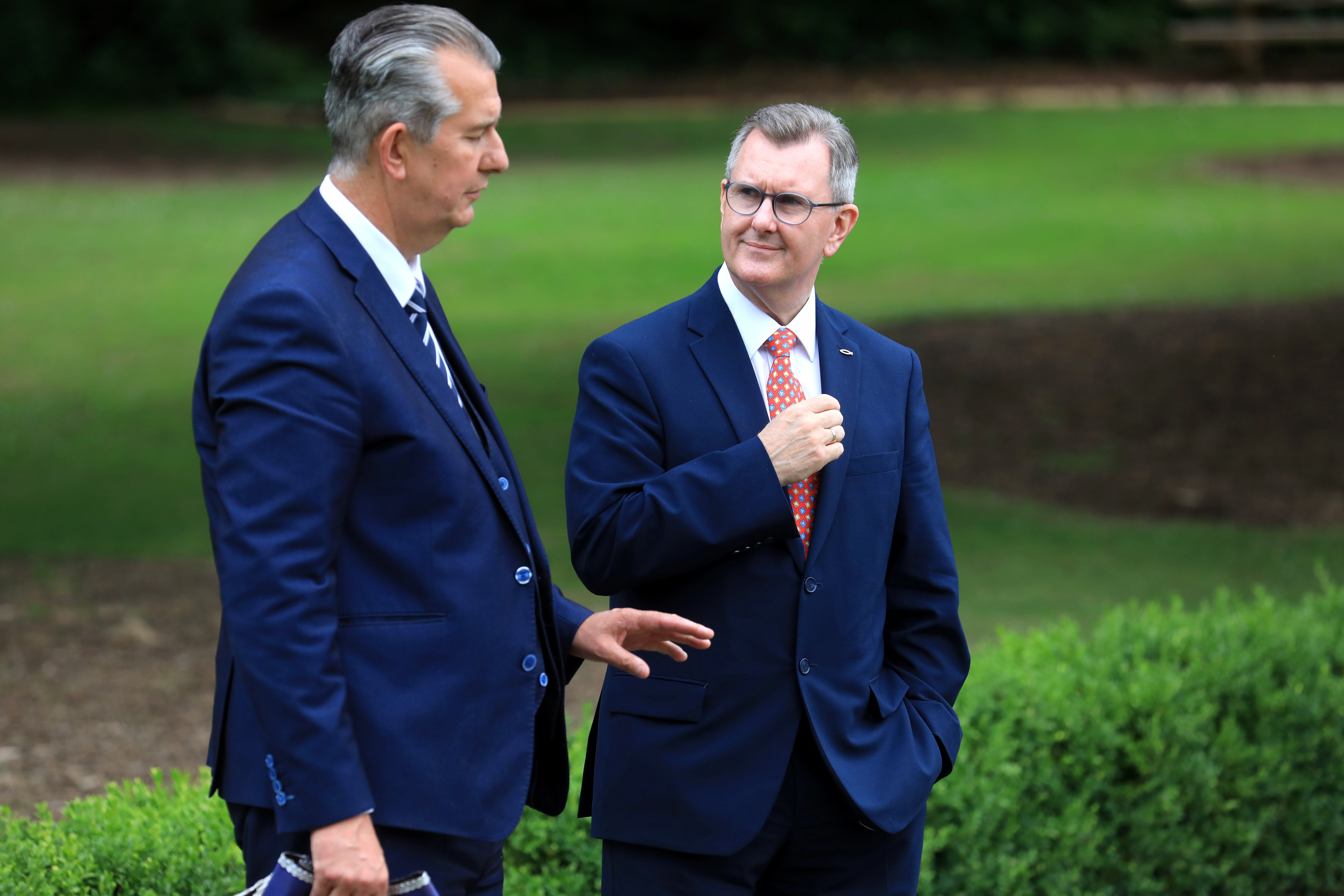 Former Democratic Unionist Party leader (DUP), Edwin Poots, (left) talks with newly elected DUP leader Sir Jeffrey Donaldson during a Battle of the Somme commemoration at Stormont, Belfast. Picture date: Thursday July 1, 2021.