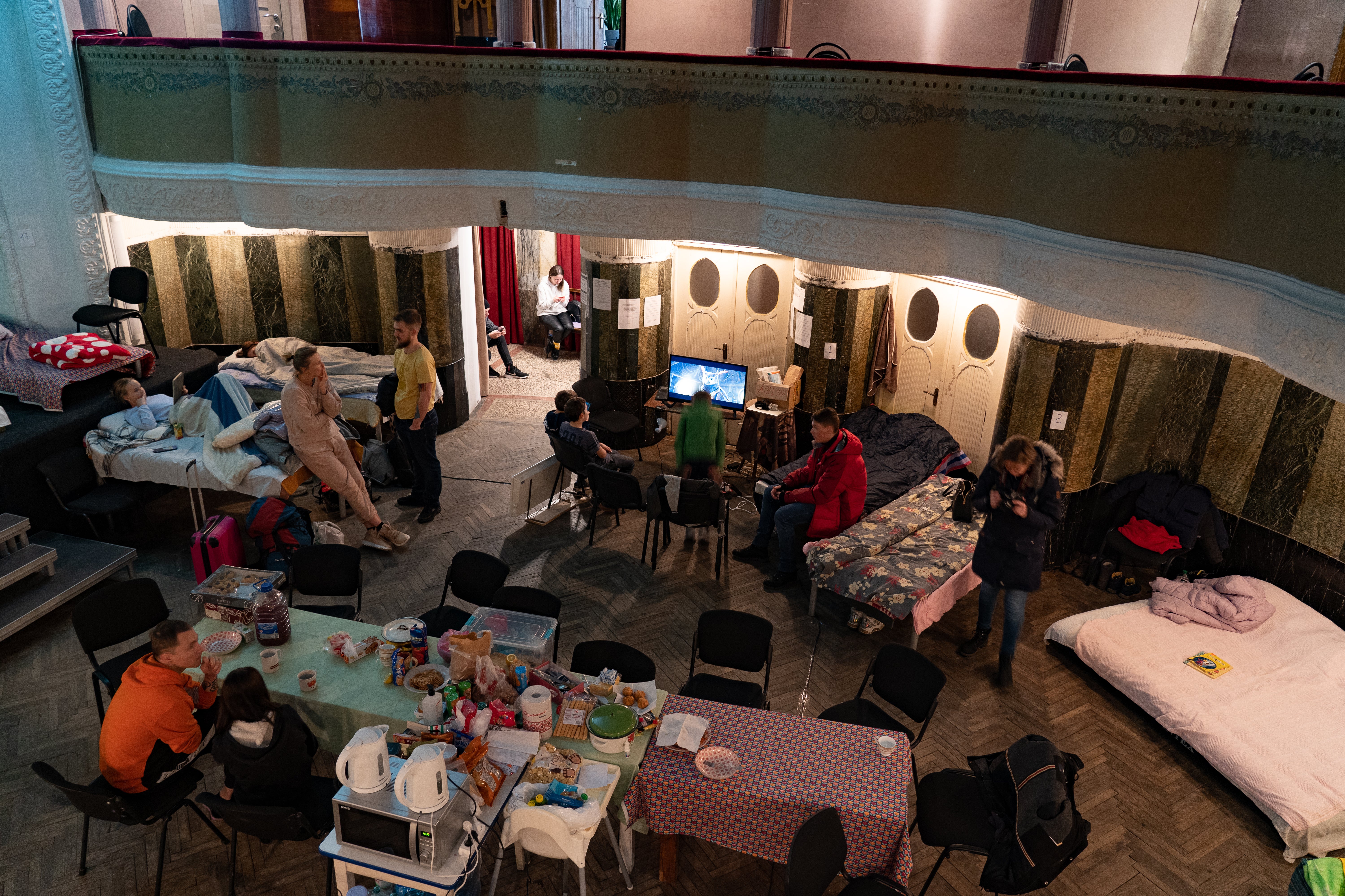 A view of the makeshift dormitory in the stalls of the theatre