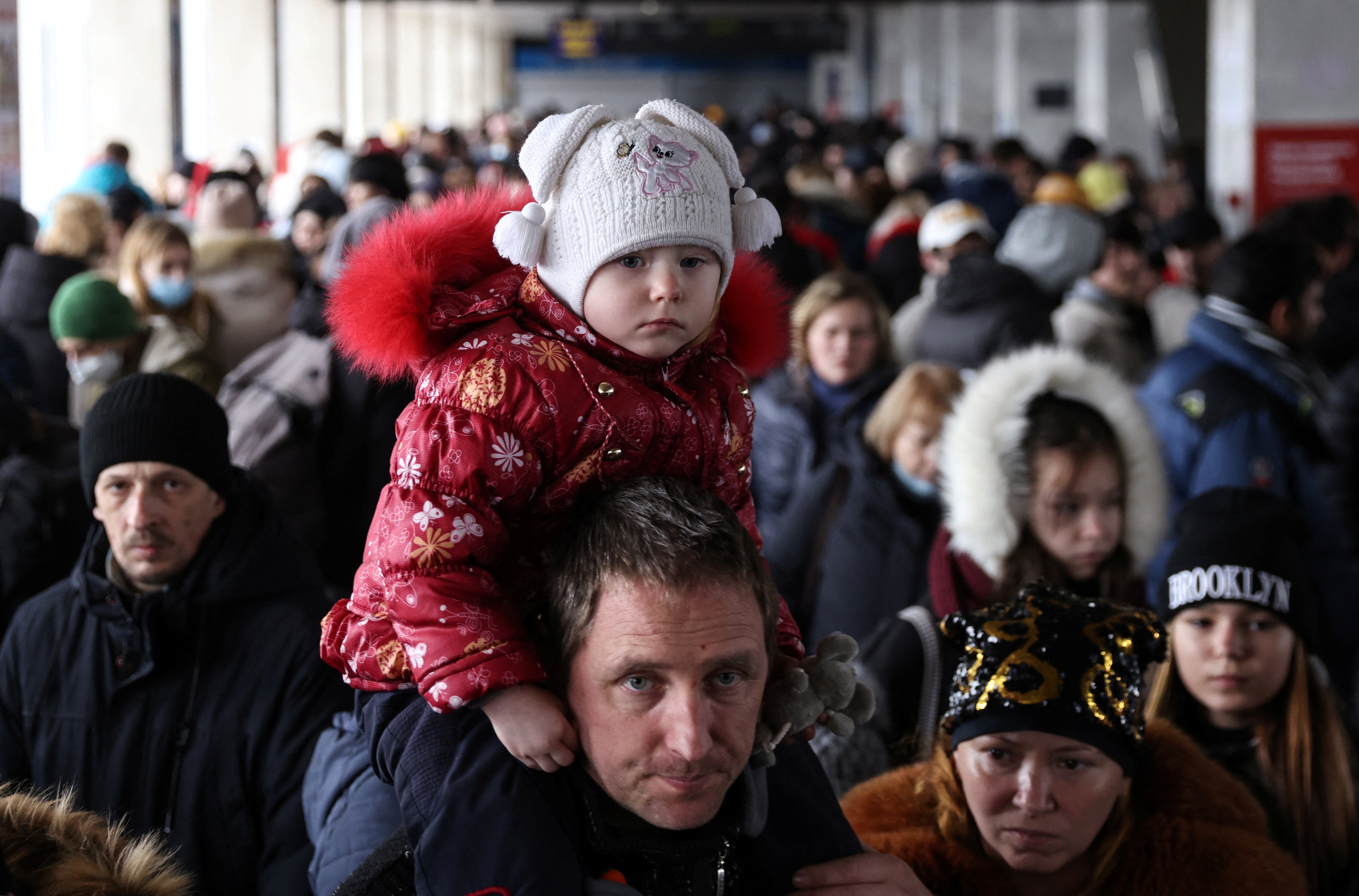 People wait to board an evacuation train from Kyiv to Lviv at Kyiv central train station