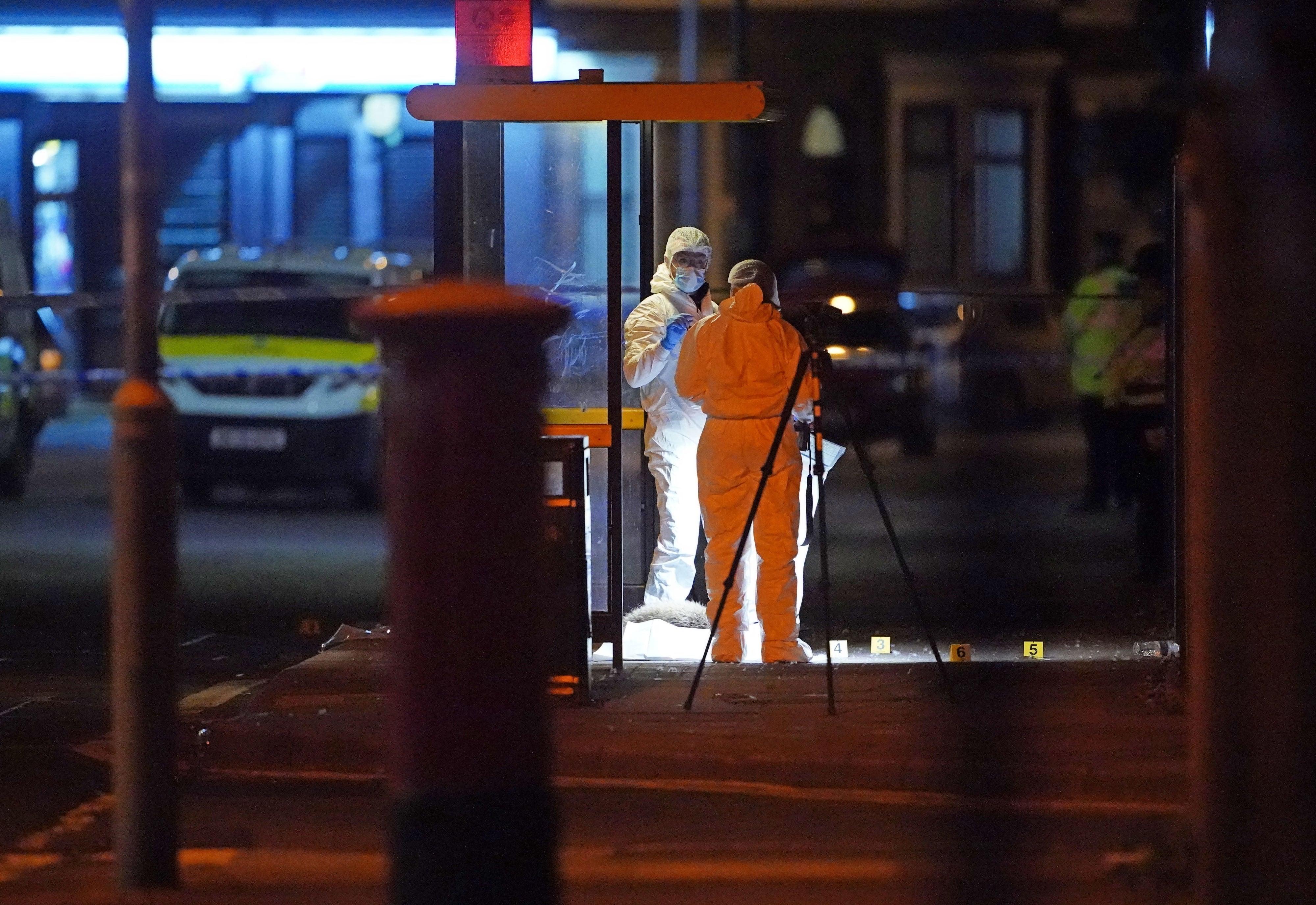 Forensic investigators at the scene of the shooting in Toxteth, Liverpool (Peter Byrne/PA)