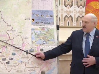 Lukashenko points towards a map in a security council meeting which appears to be a battle plan for Russia’s invasion of Ukraine