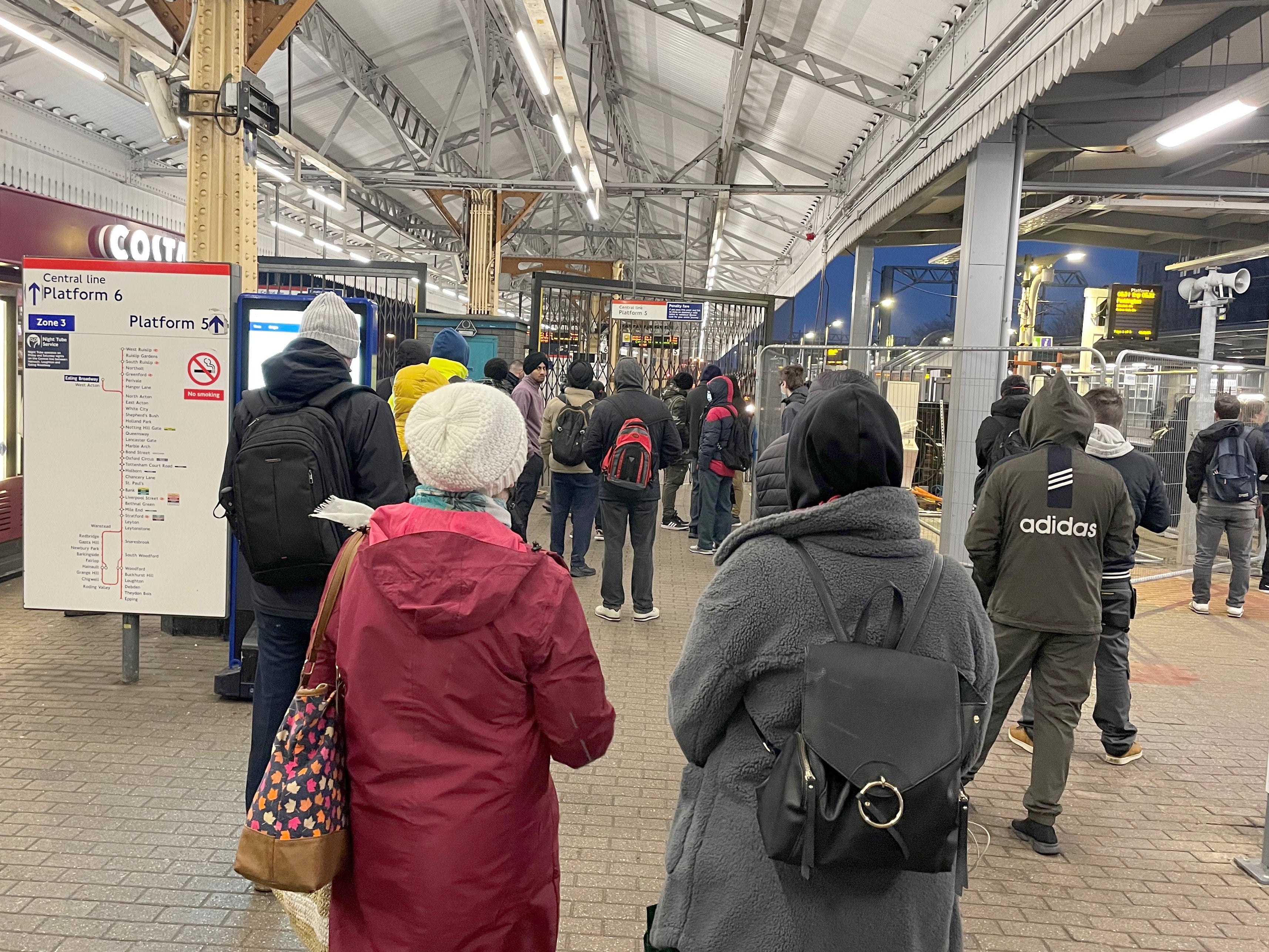 Commuters wait for services to resume at Ealing Broadway Tube station in London (PA)