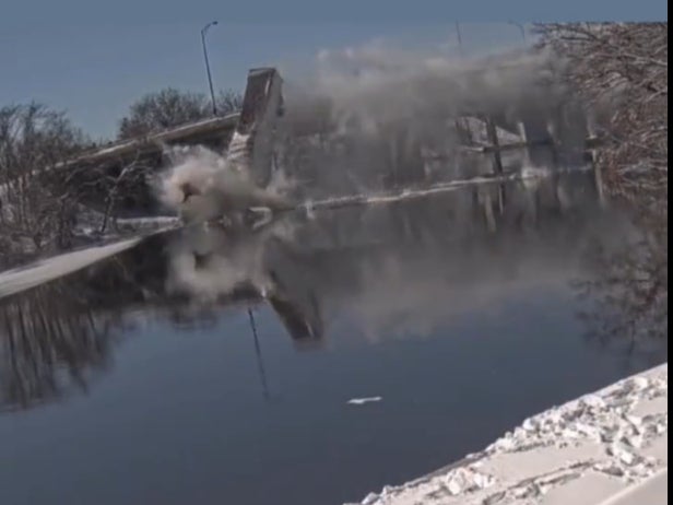 A US Postal Service truck fell off a bridge into a river near Boston on Saturday