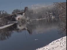 US Postal Service truck flies off 50-foot bridge into Boston river