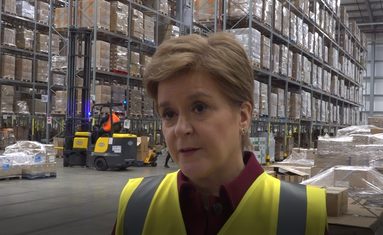 First Minister Nicola Sturgeon at an NHS National Services Scotland warehgouse as 500,000 items are packed to be sent to Ukraine (Tom Eden/PA)