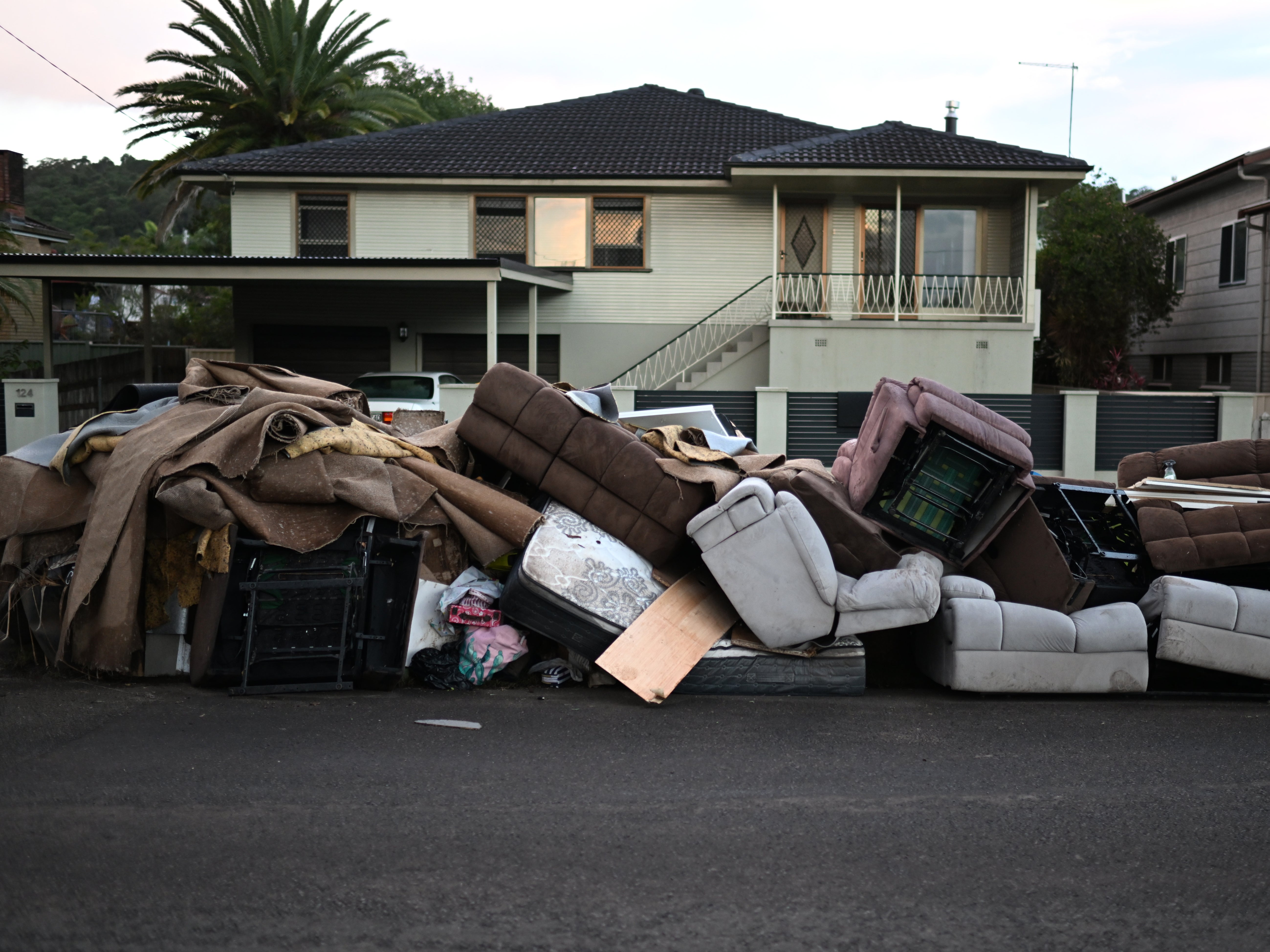 Discarded furniture outside a flood affected property in Lismore