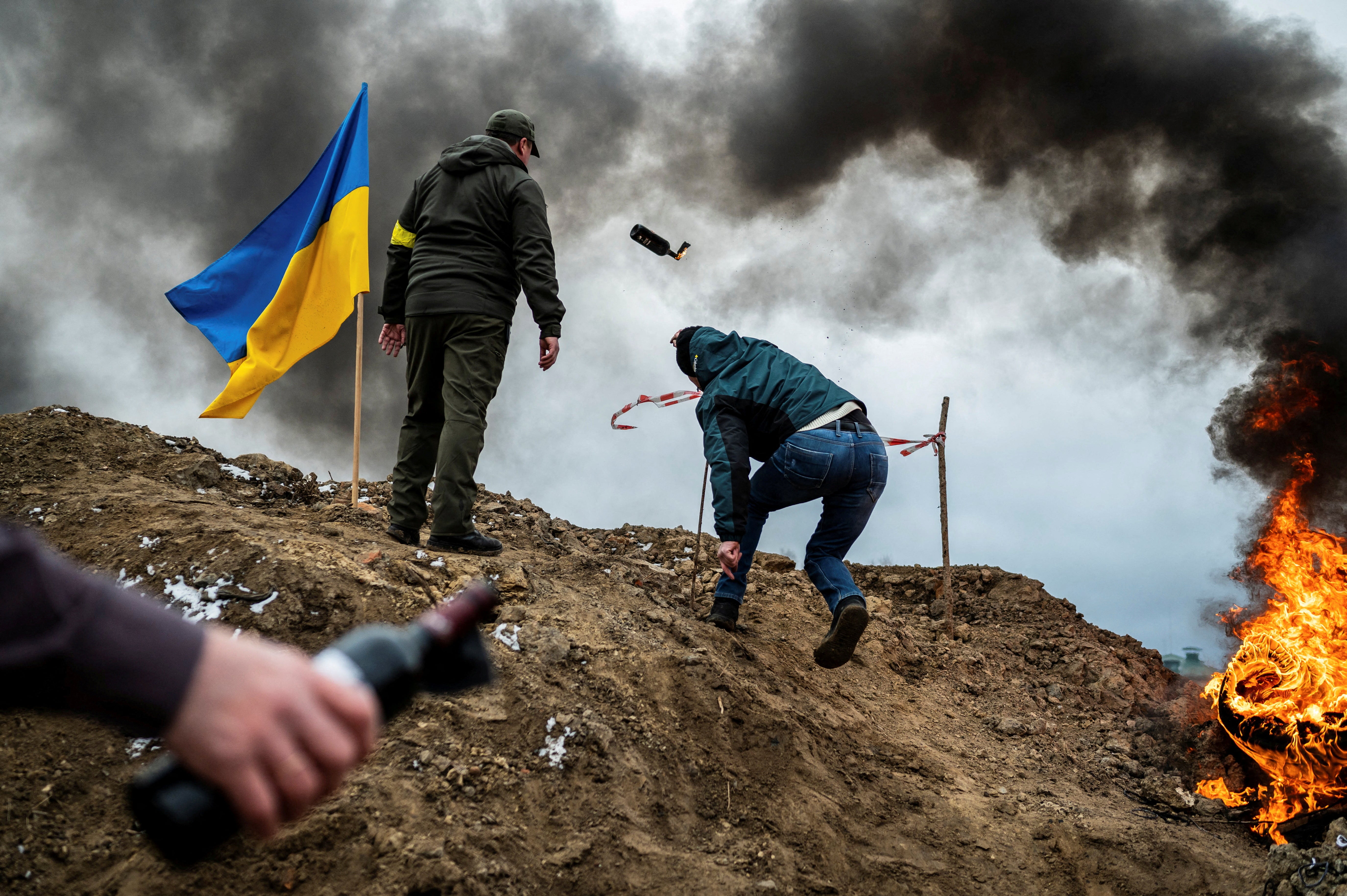 A civilian trains to throw Molotov cocktails to defend the city in Zhytomyr