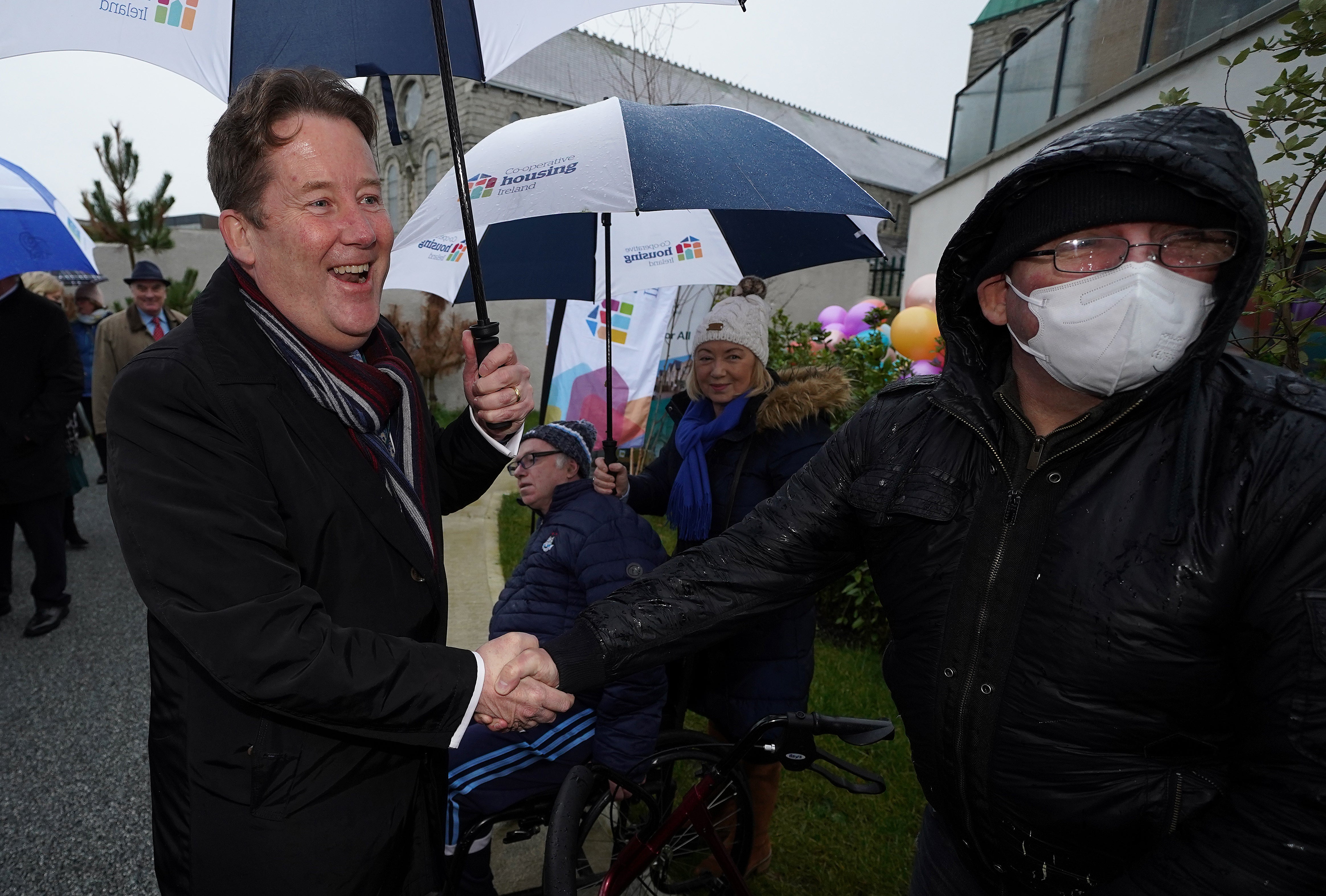 Minister for Housing Darragh O’Brien (left) with resident Derek Keogh at St Canice’s Hall housing development in Finglas (Brian Lawless/PA)