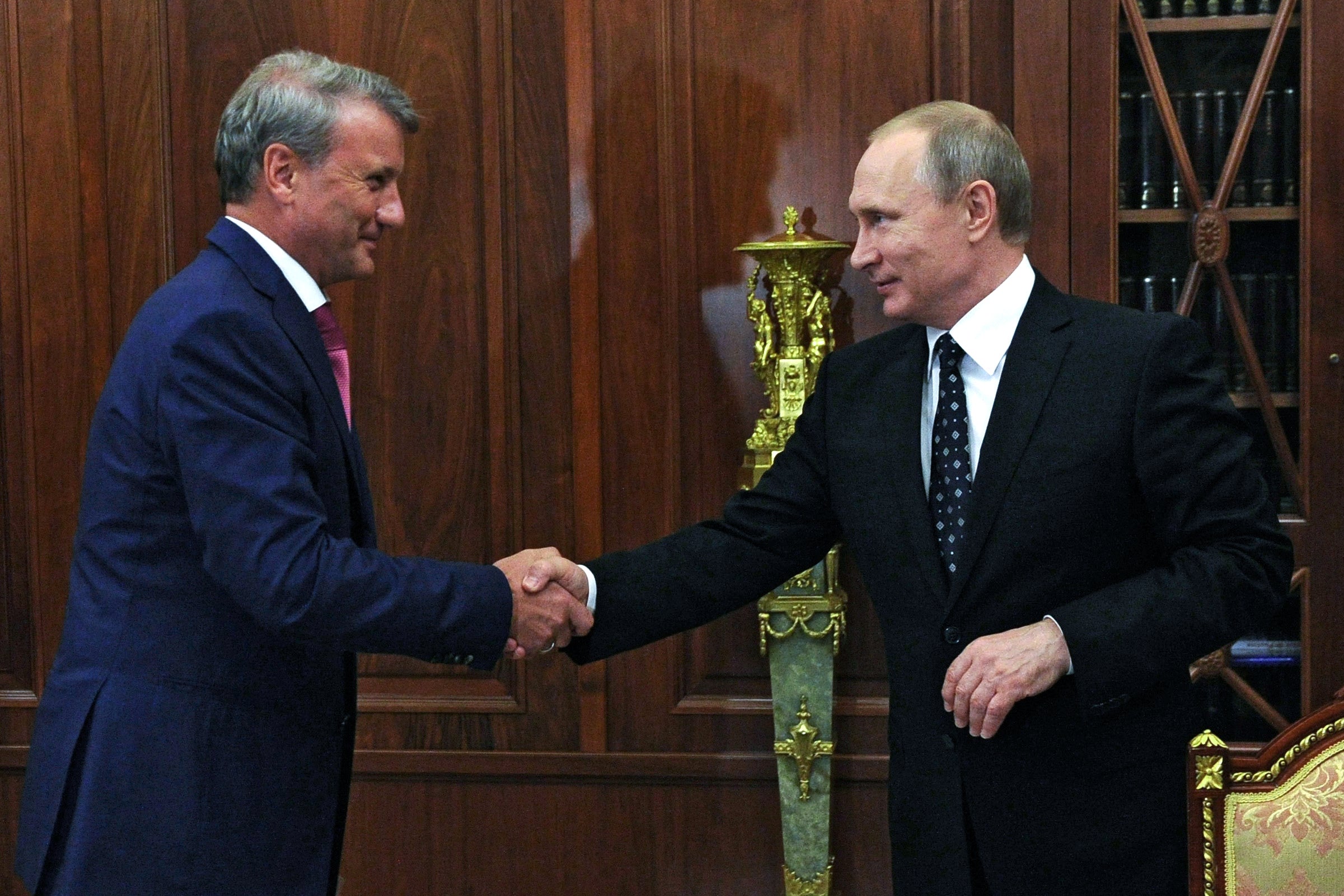 Sberbank’s CEO, Herman Gref, pictured left, has been described as an ally of Vladimir Putin