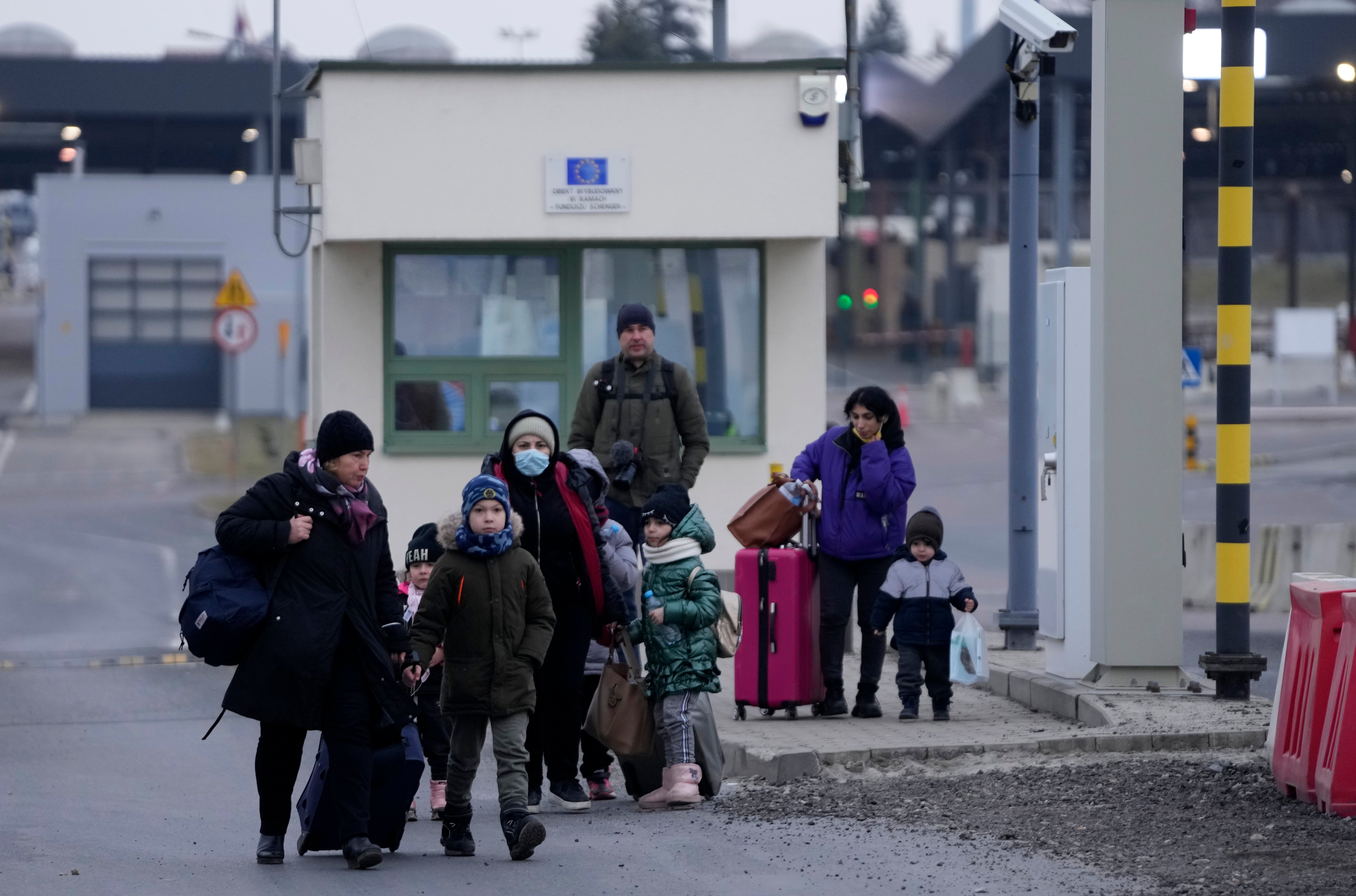 People from Ukraine arrive at the border crossing in Medyka, southeastern Poland