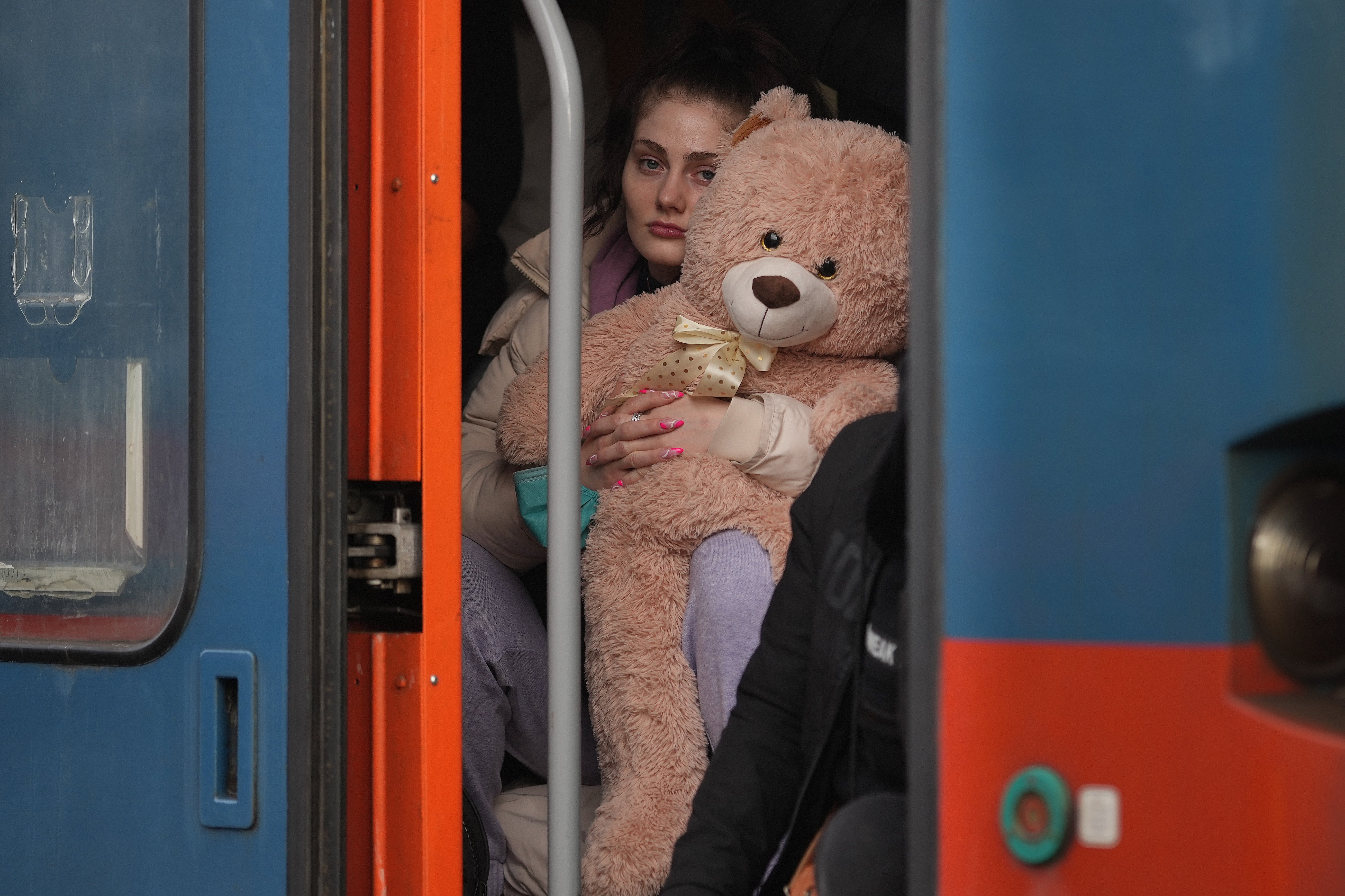 Refugees arrive at the Hungarian border town of Zahony on a train that has come from Ukraine