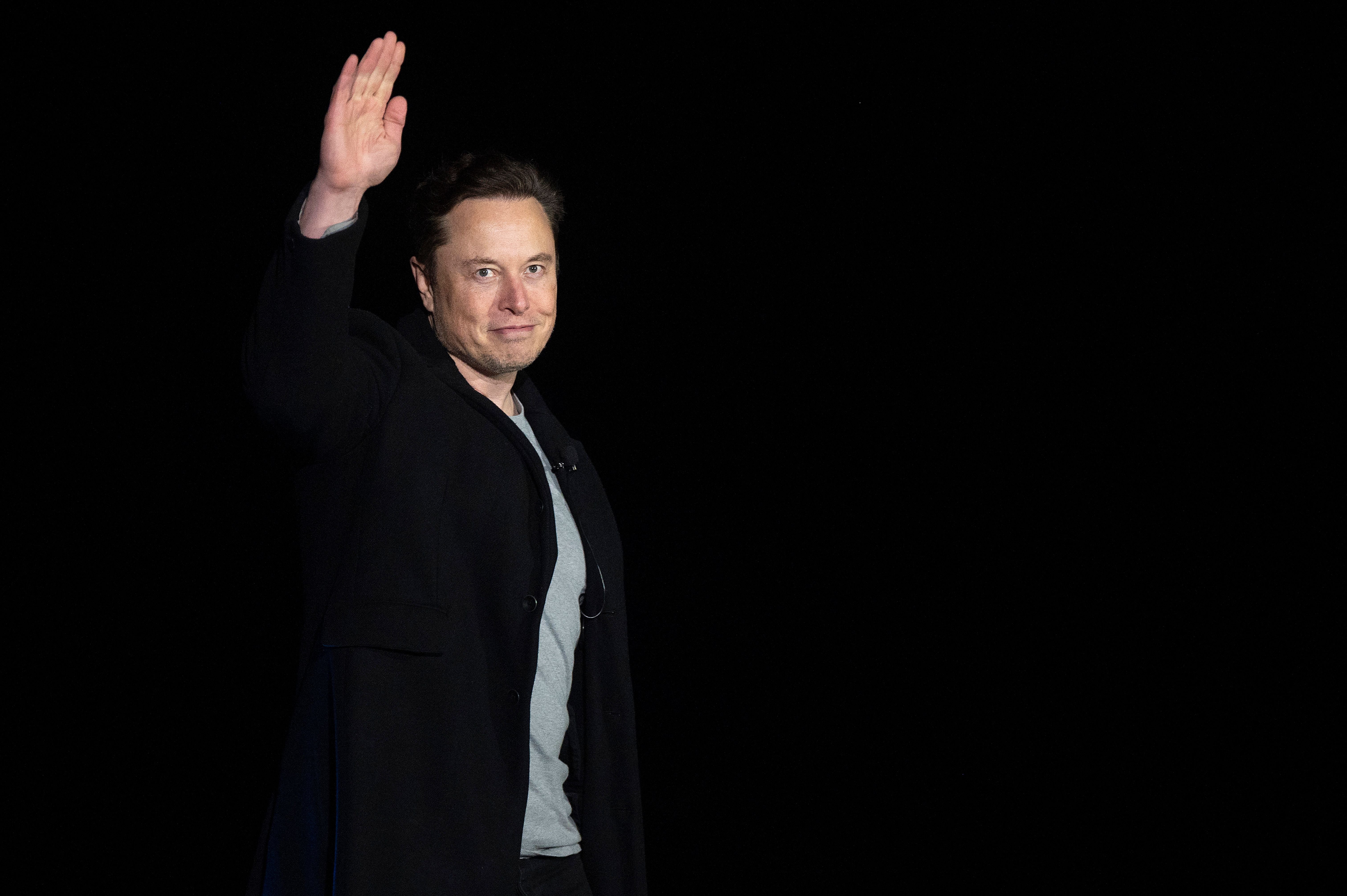 Elon Musk gestures as he speaks during a press conference at SpaceX's Starbase facility near Boca Chica Village in South Texas on February 10, 2022.