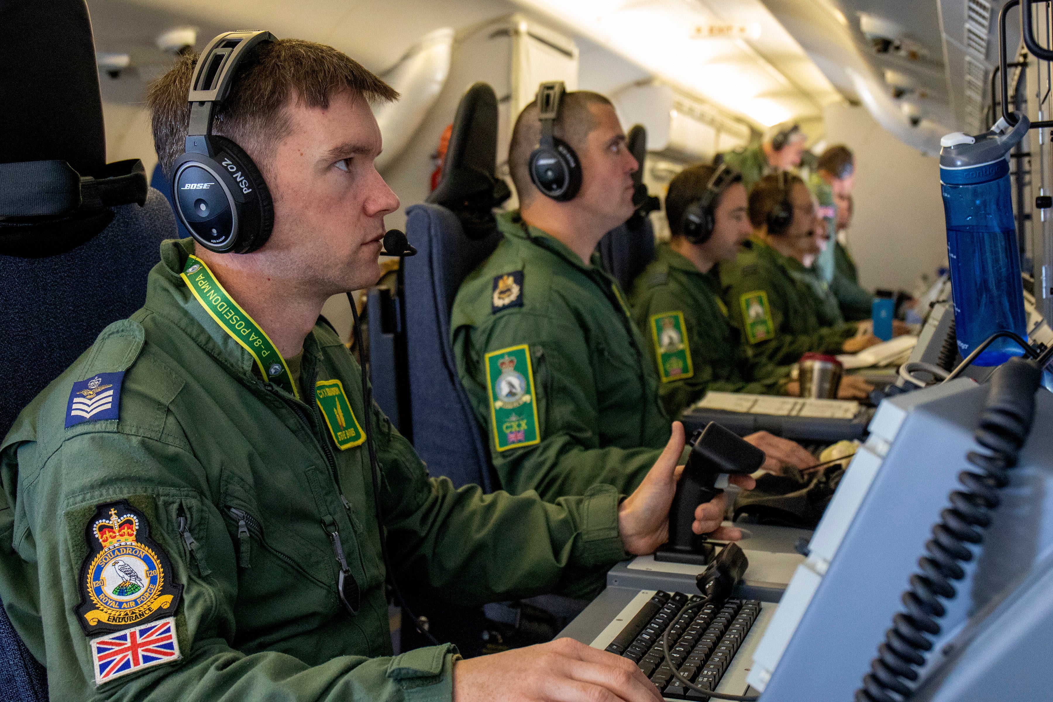 Crew members on board an RAF P-8A Poseidon, pictured in 2020