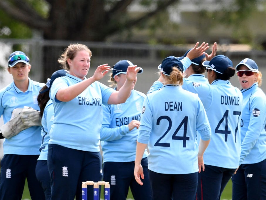 Anya Shrubsole celebrates with teammate