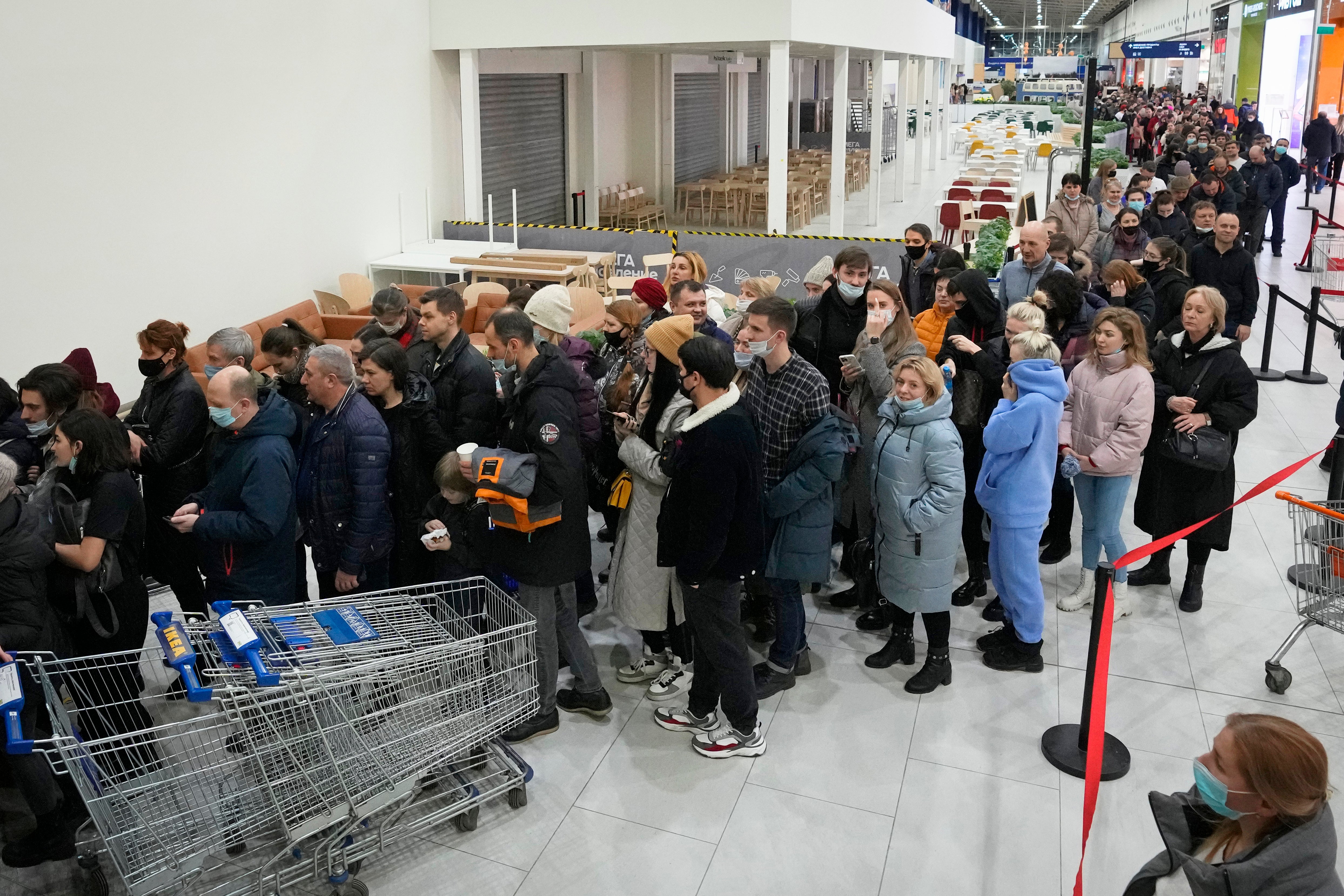 People wait in a line to enter the IKEA store at the outskirts of St. Petersburg, Russia, on Thursday.