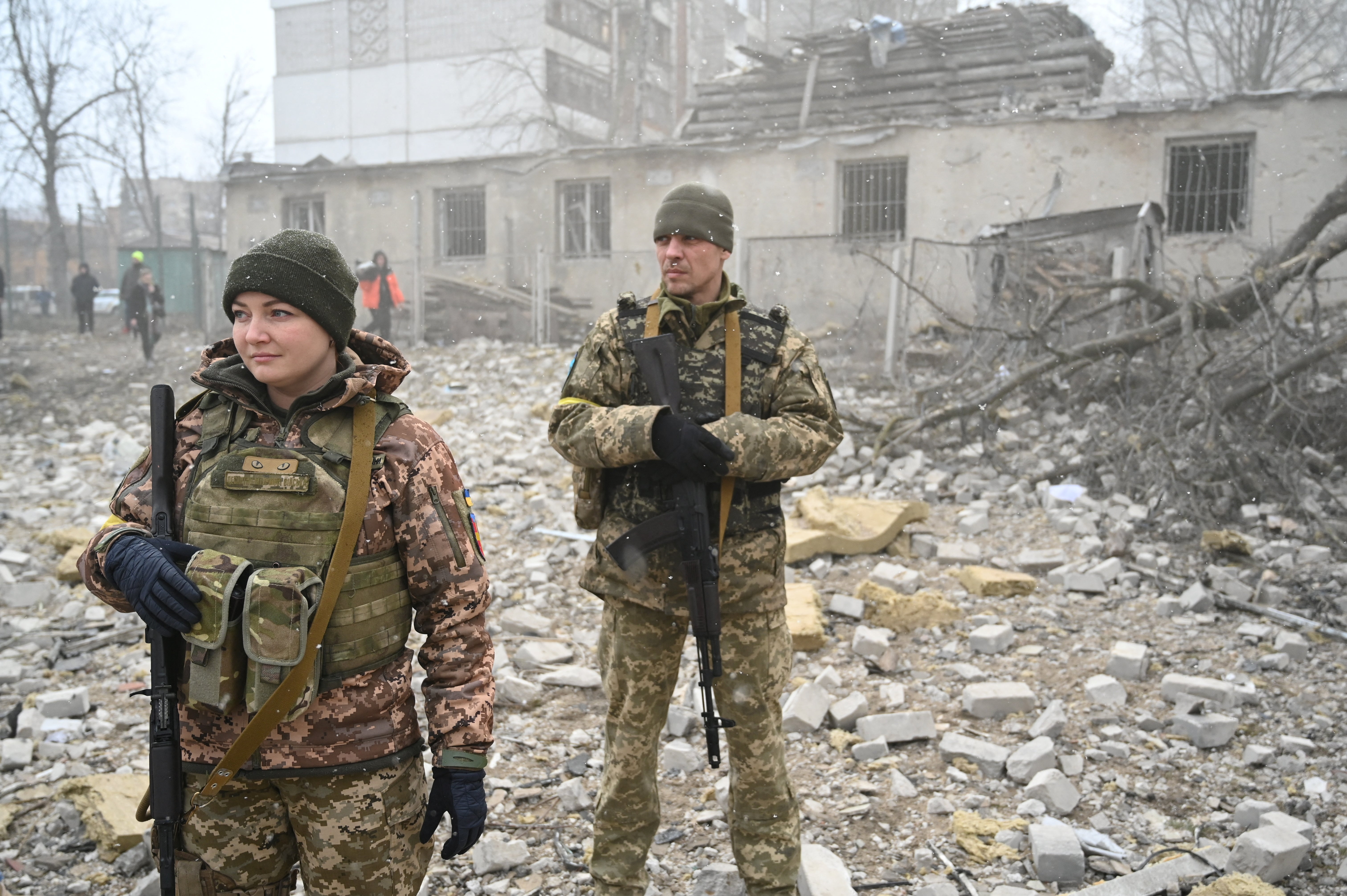 Ukrainian service members were at the scene after the shelling on Friday