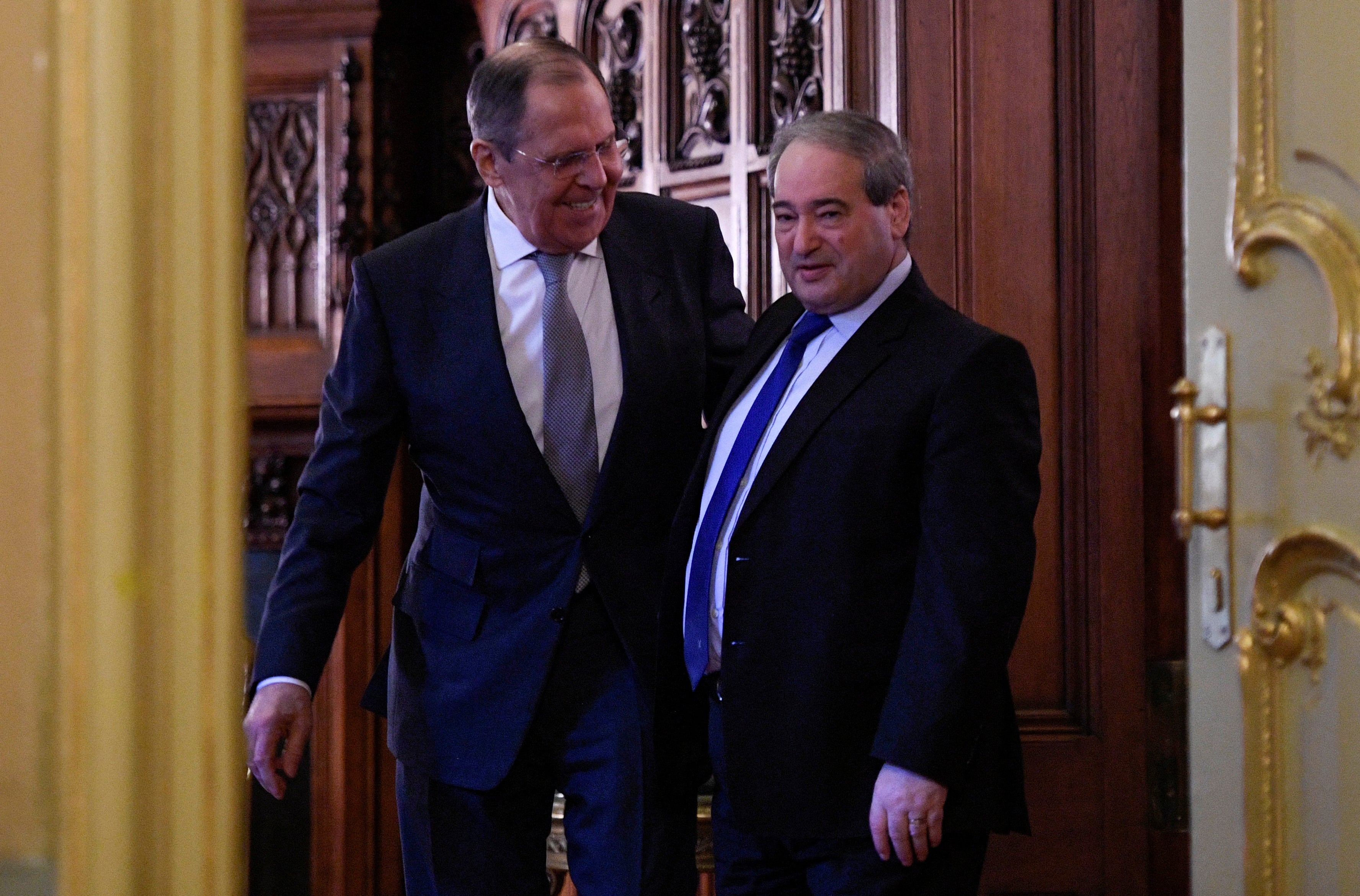 Lavrov and Syria's Foreign Minister Faisal Mekdad enter a hall as they attend a news conference following their talks in Russia last month.