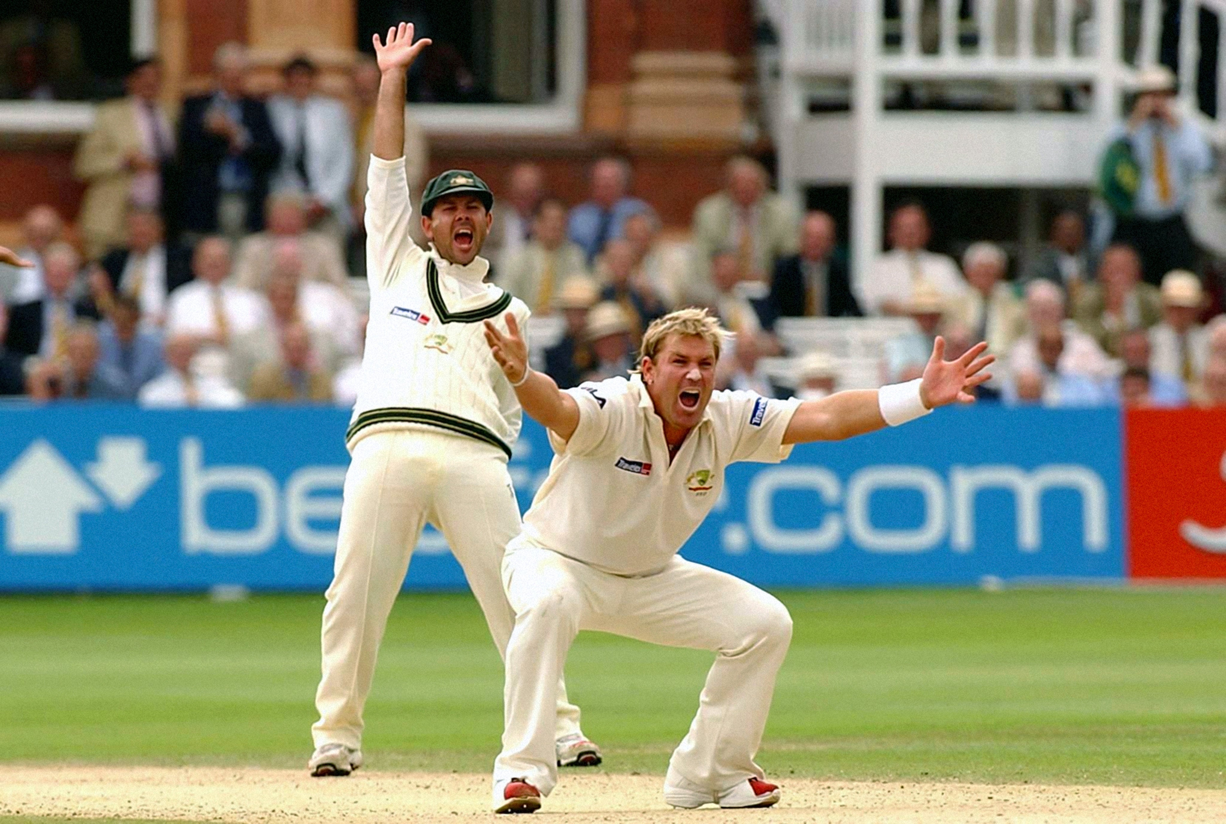 Warne, right, and Ricky Ponting unsuccessfully appeal for the wicket of England’s Andrew Strauss in July 2005 (Sean Dempsey/PA)