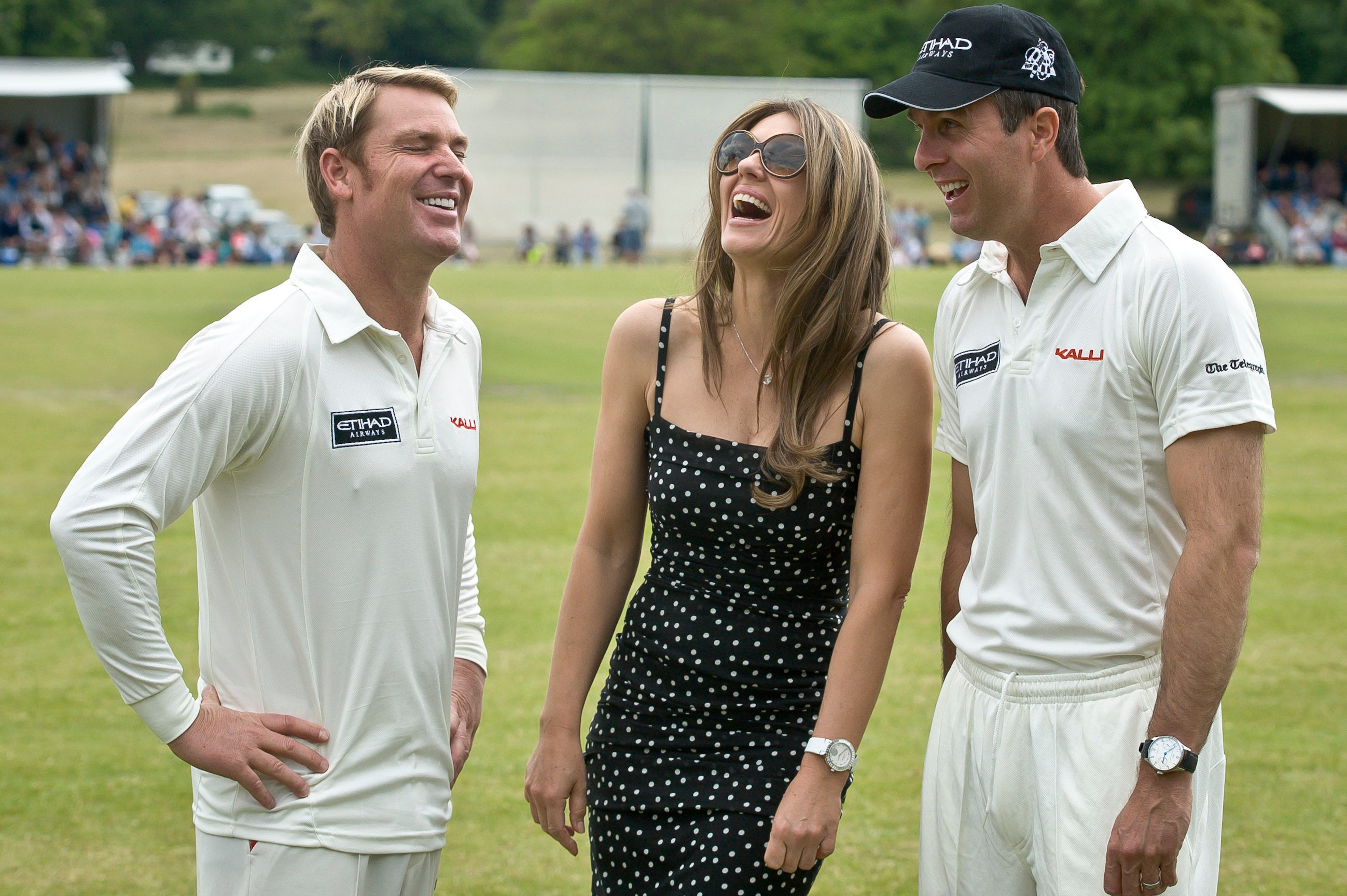 Warne shares a joke with Hurley and England’s Michael Vaughan in June 2013 (Ben Birchall/PA)