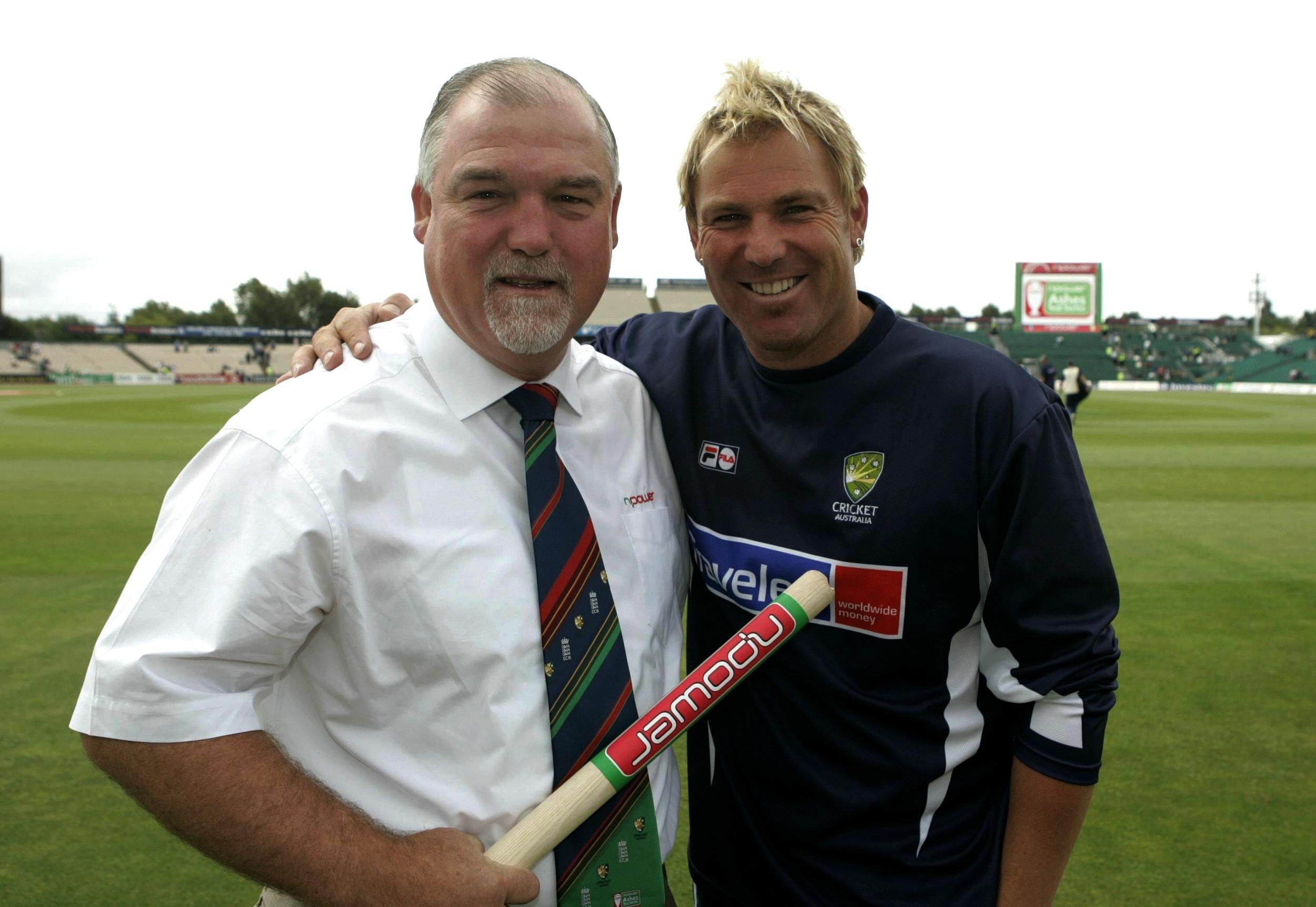 Former England batsman Mike Gatting congratulates Warne for passing 600 Test match wickets. Warne took his first England Test wicket in 1993, when he clean bowled Gatting around his legs with his very first delivery against England (Phil Noble/PA)