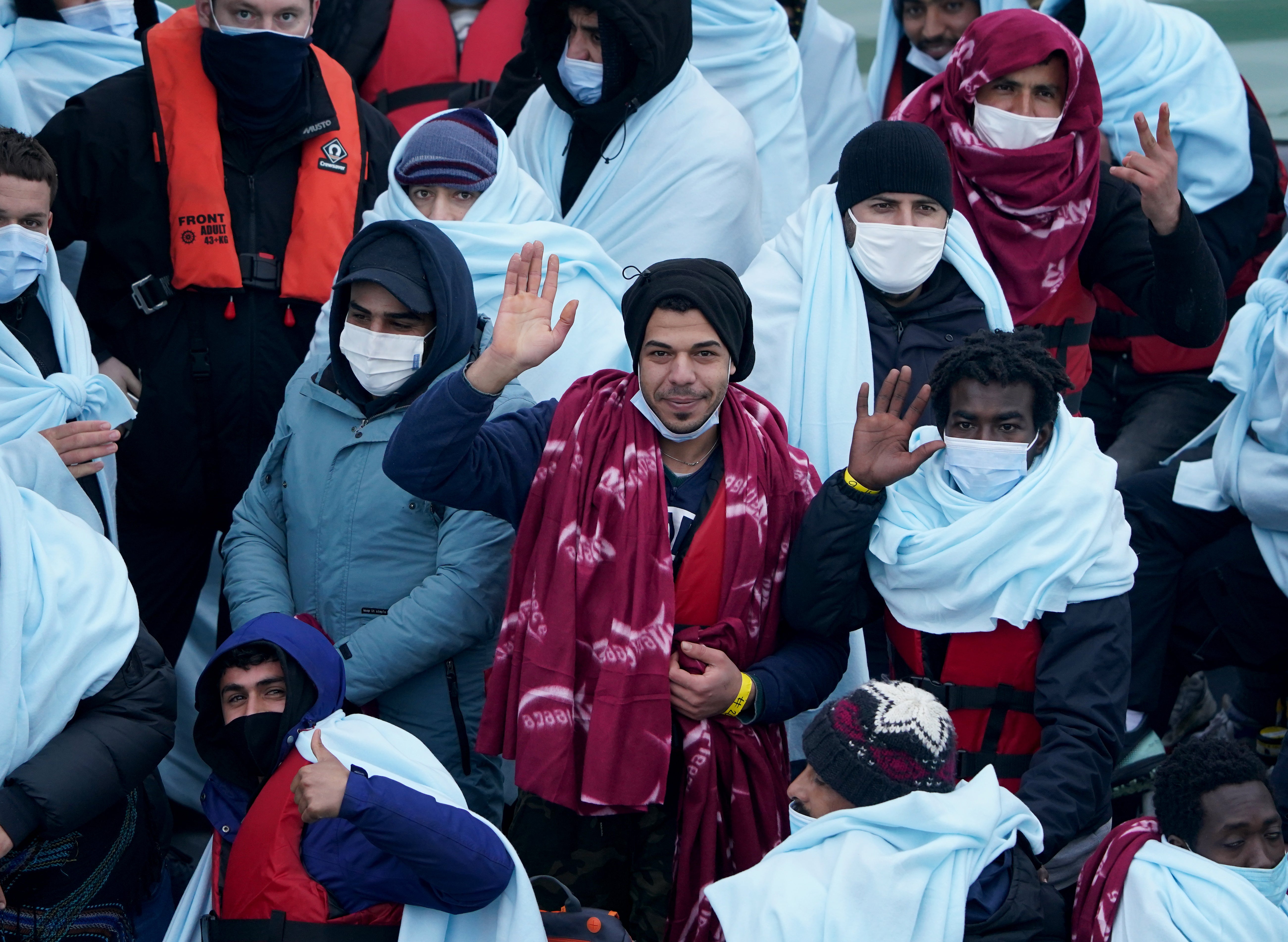 A group of people thought to be migrants are brought in to Dover, Kent, onboard a Border Force vessel following a small boat incident in the Channel (Gareth Fuller/PA)