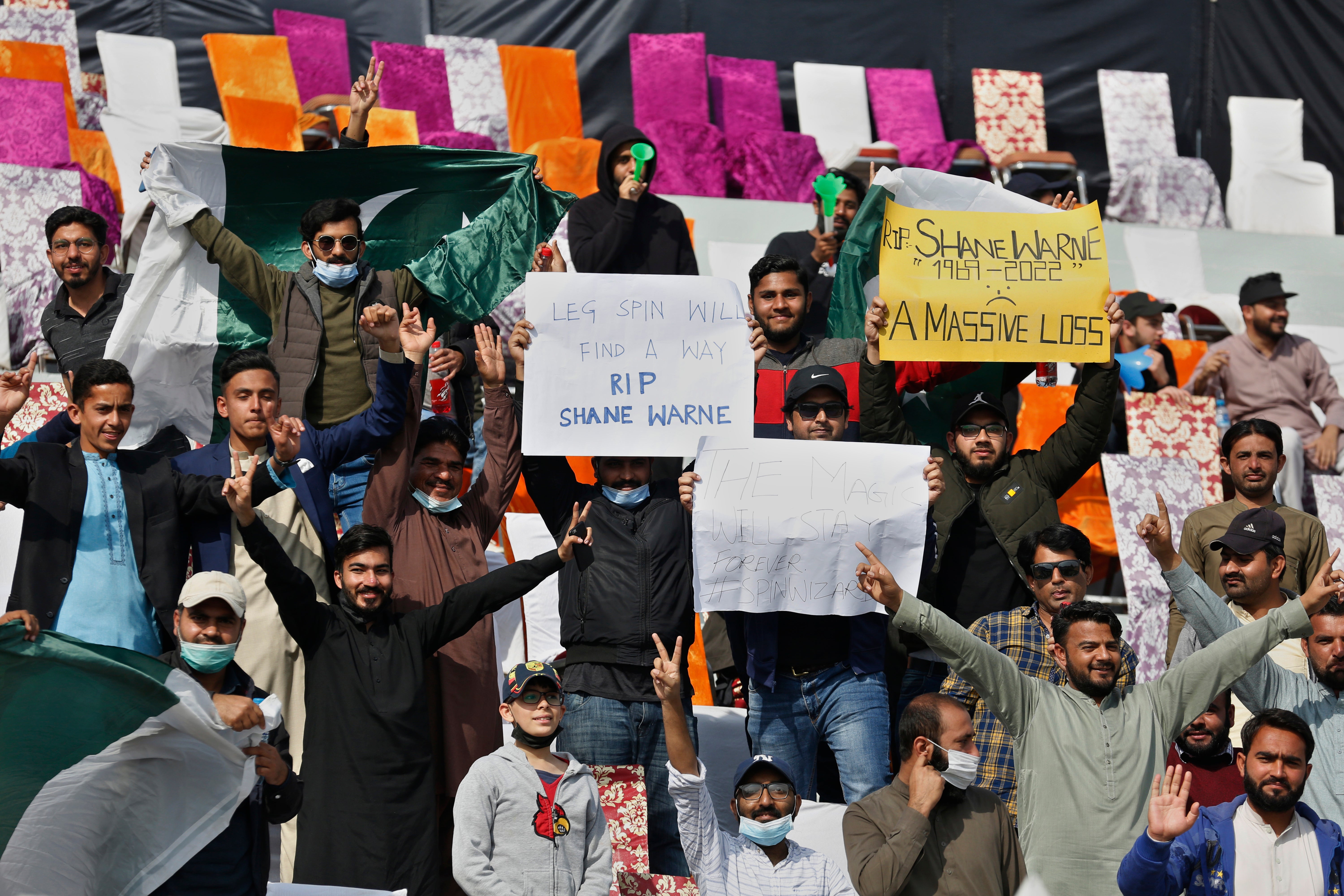 Pakistan fans held up placards in tribute to Warne (AP Photo/Anjum Naveed)