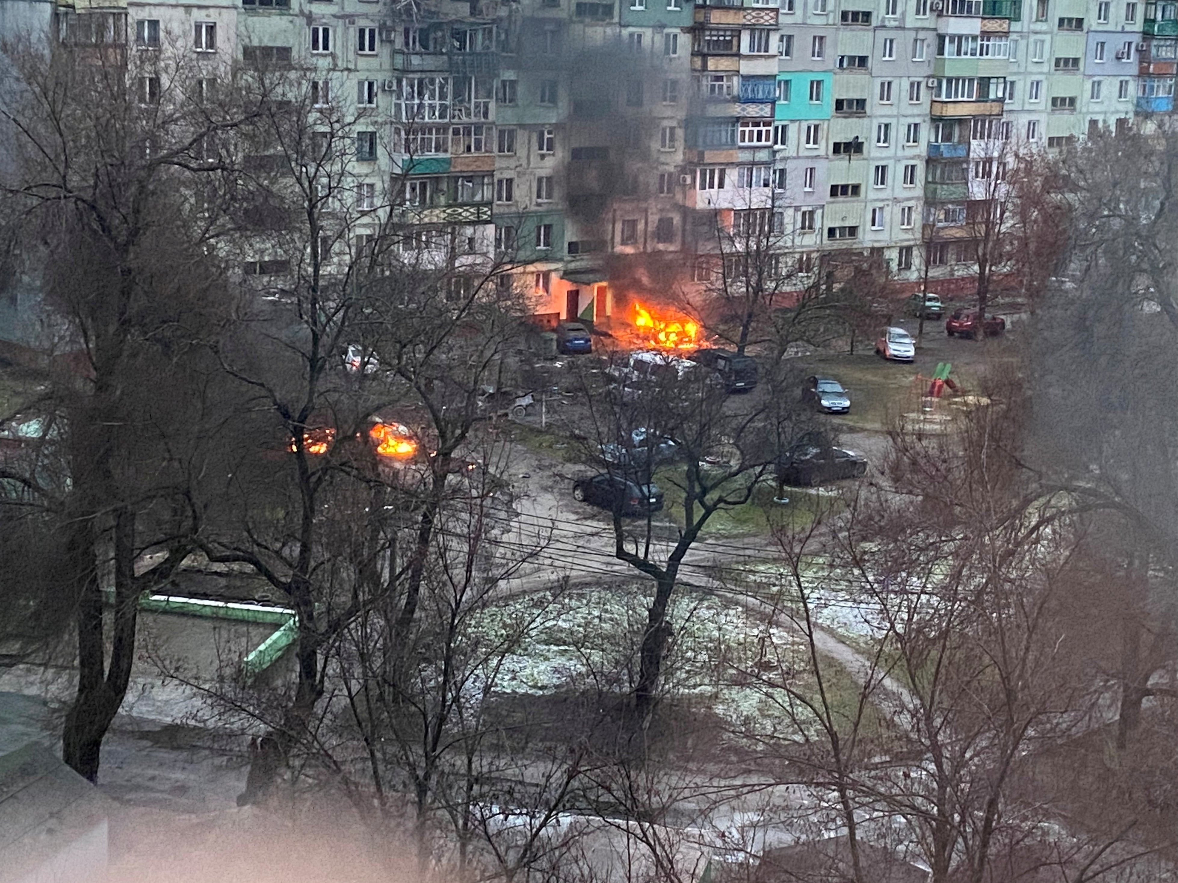 Fire is seen in Mariupol at a residential area after shelling amid Russia's invasion of Ukraine