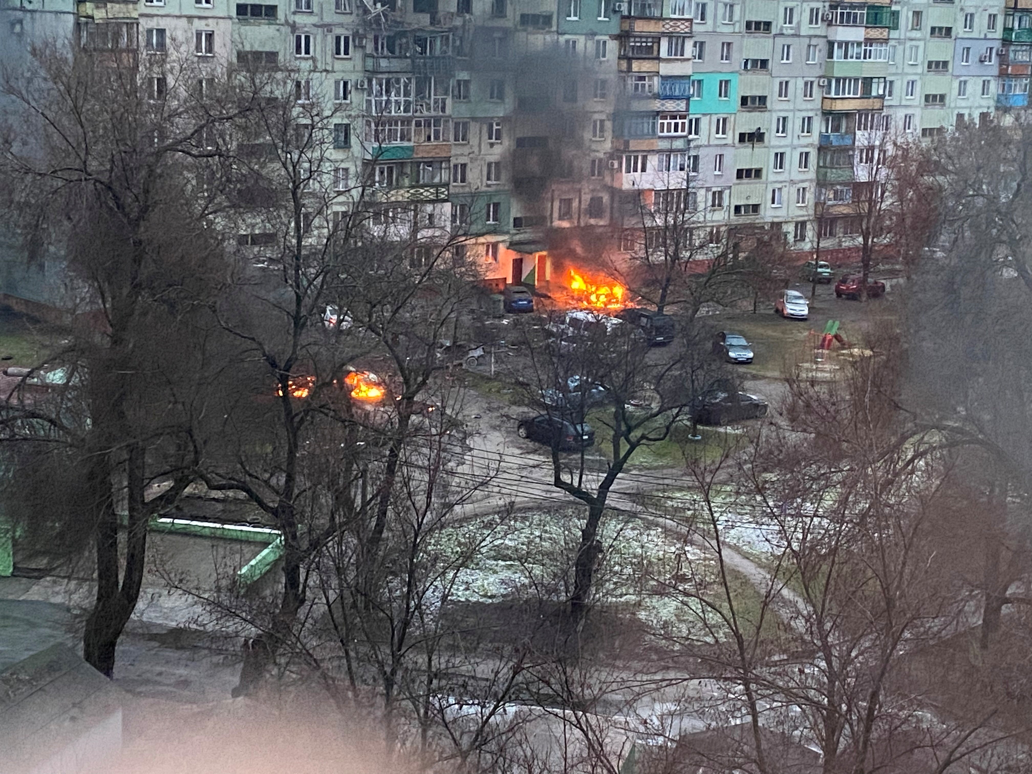 Fire is seen in Mariupol at a residential area after shelling amid Russia's invasion of Ukraine