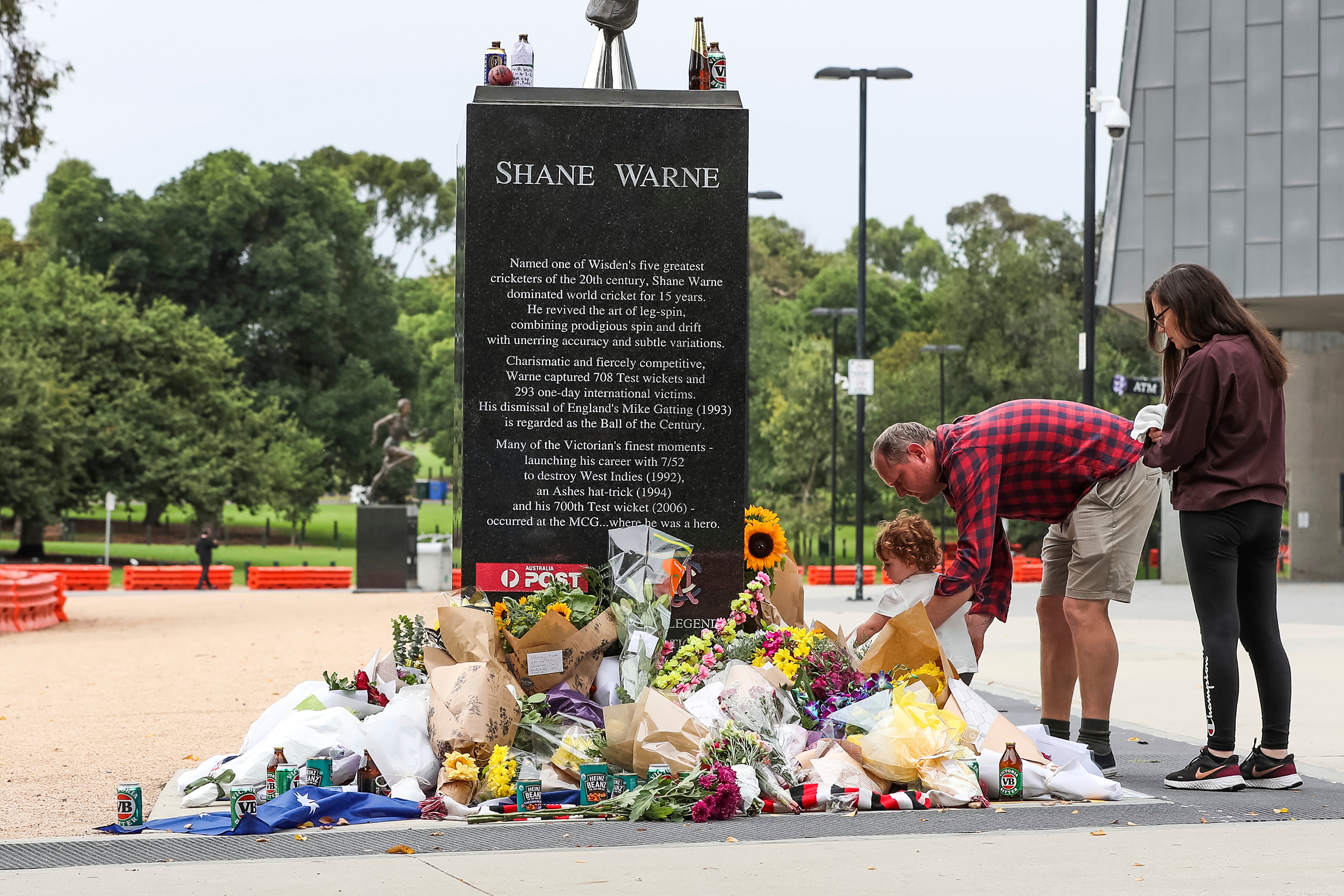 Flowers are laid at the statue of Shane Warne outside the Melbourne Cricket Ground