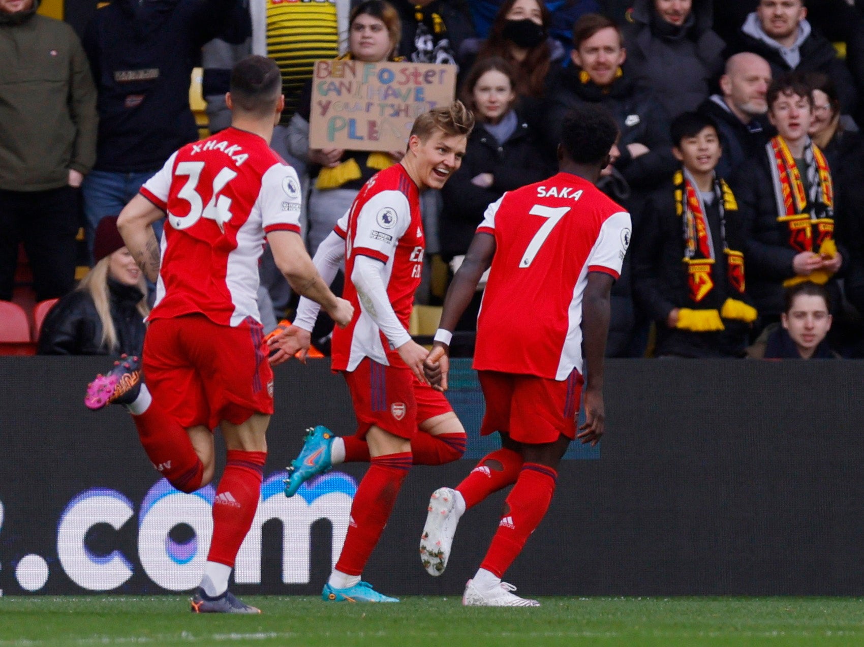 Martin Odegaard celebrates scoring with Bukayo Saka