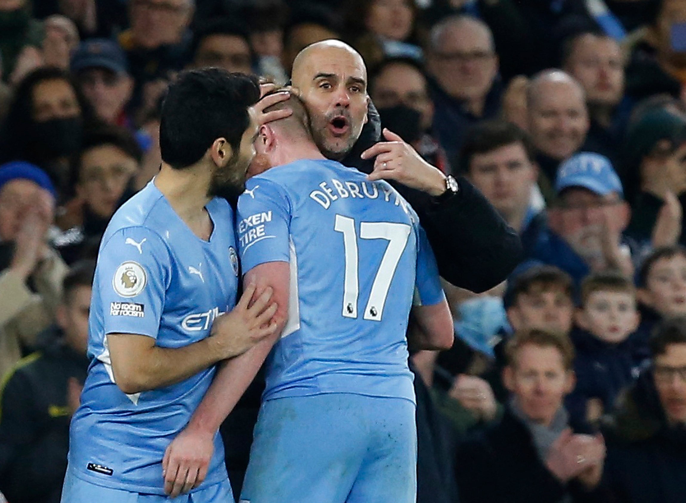 Kevin De Bruyne is congratulated by Pep Guardiola