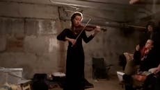 Violinist plays in bomb shelter as Russian attacks on Ukraine continue