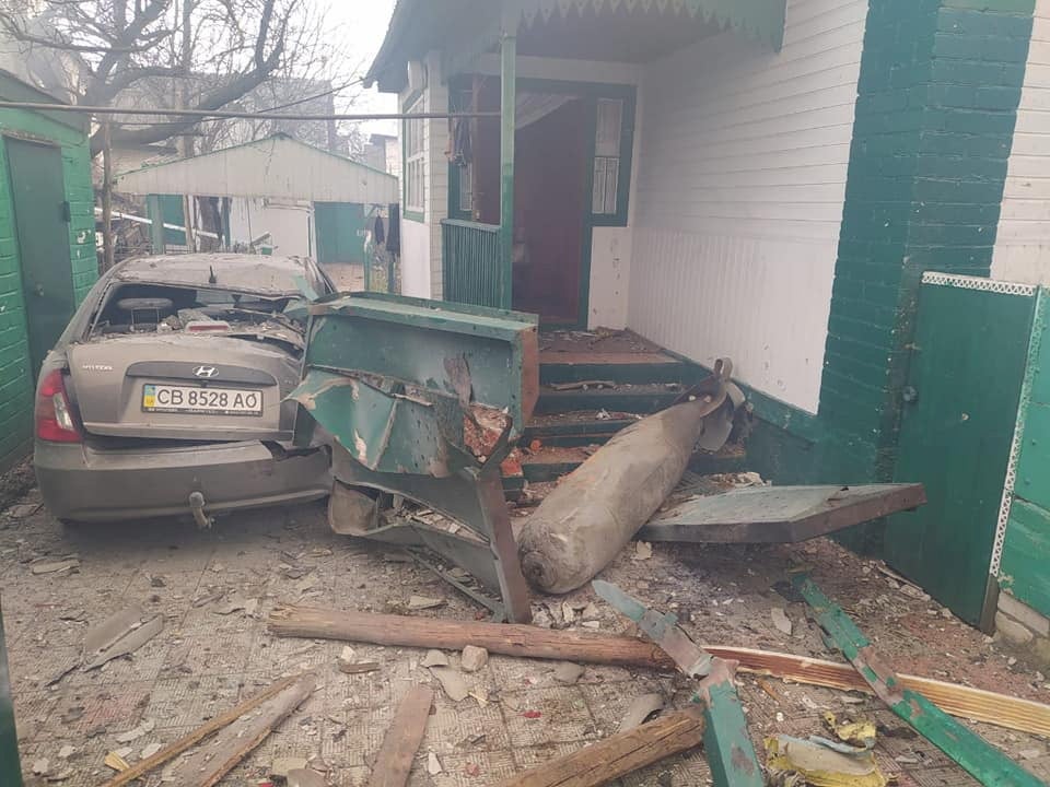 A non exploded Russian aviation bomb FAB-500 is seen next to a private house.