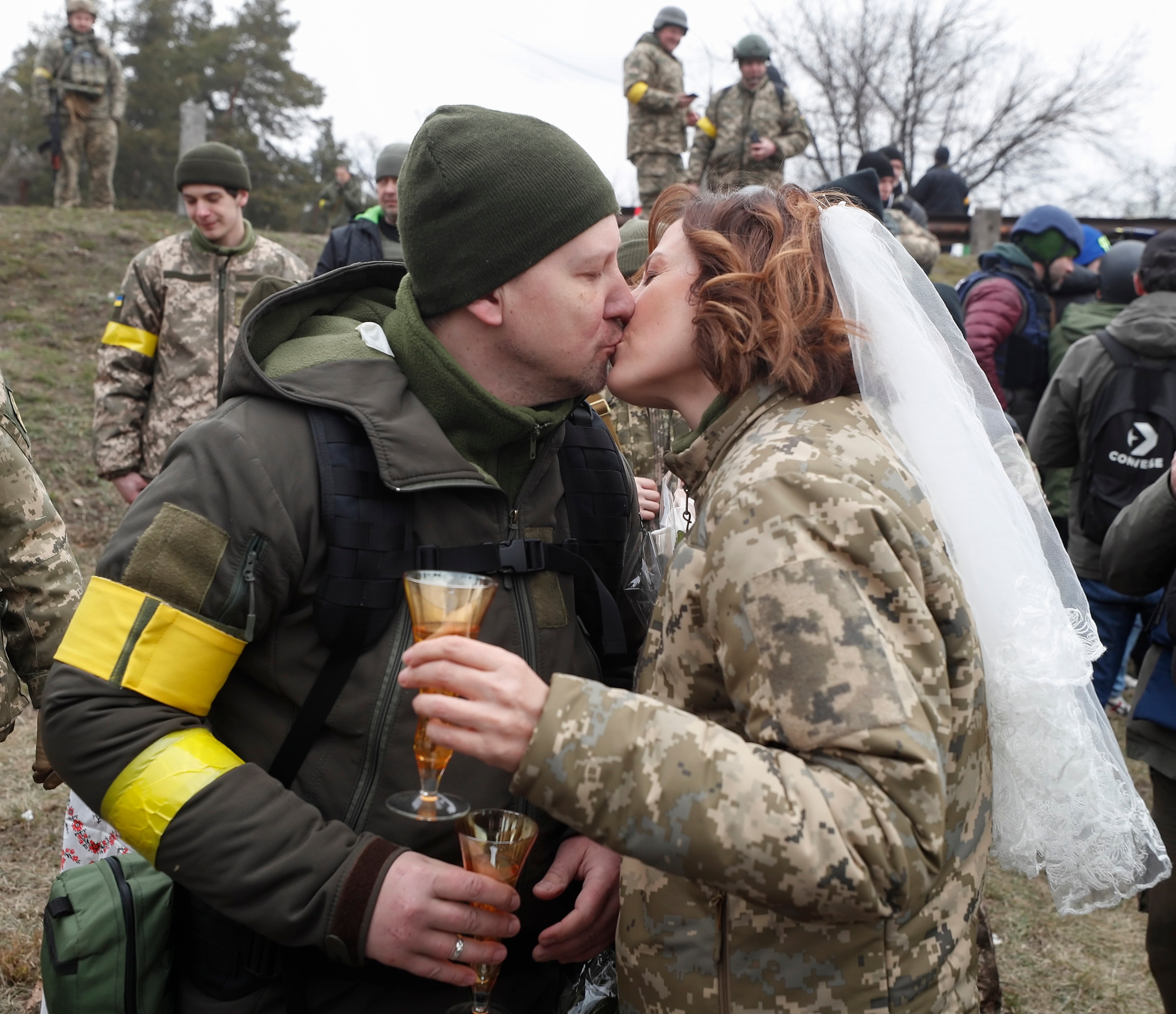 Ukrainian territorial defense fighters Valeriy and Lesya during their wedding ceremony at a blockpost near Kyiv.