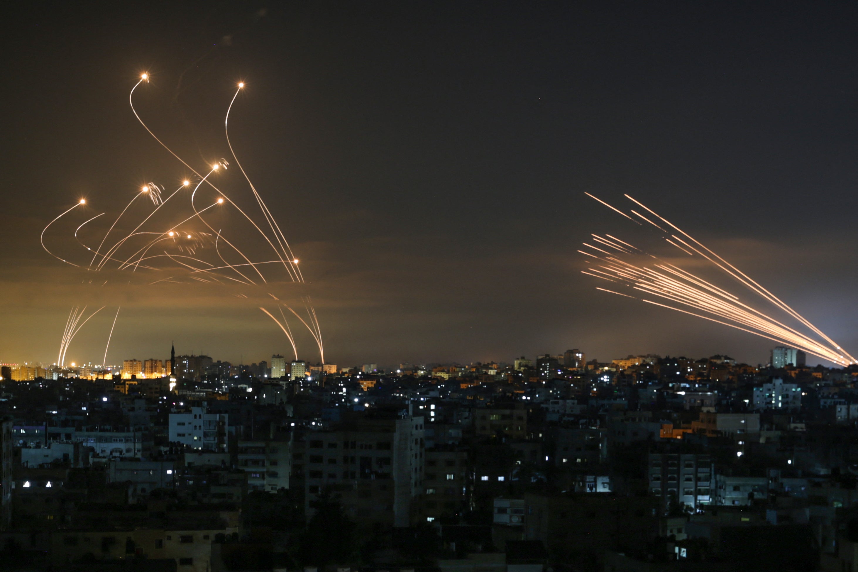 The Israeli Iron Dome missile defence system intercepts rockets fired by the Hamas movement towards southern Israel from Beit Lahia in the northern Gaza Strip