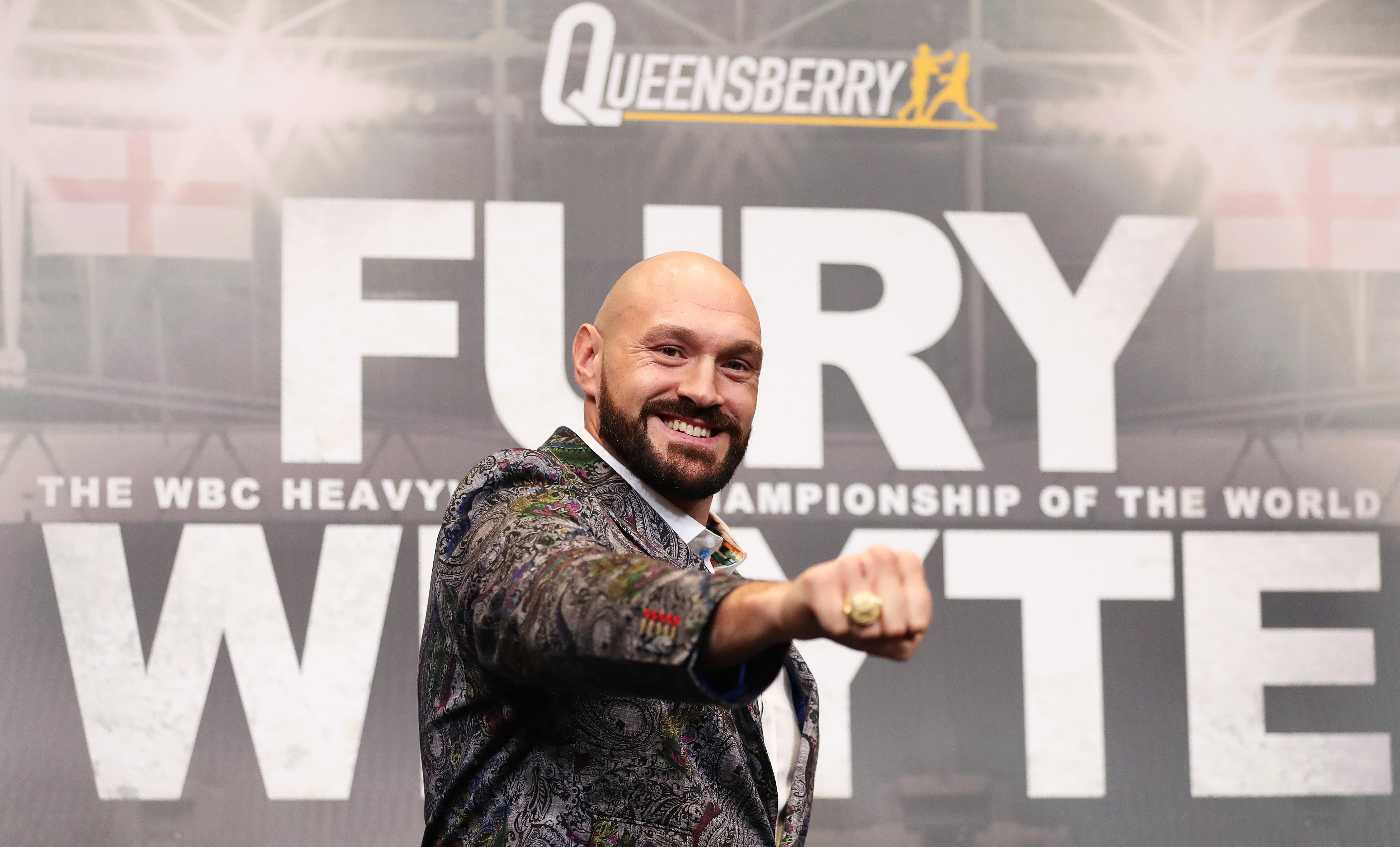 Tyson Fury poses at a press conference at Wembley Stadium