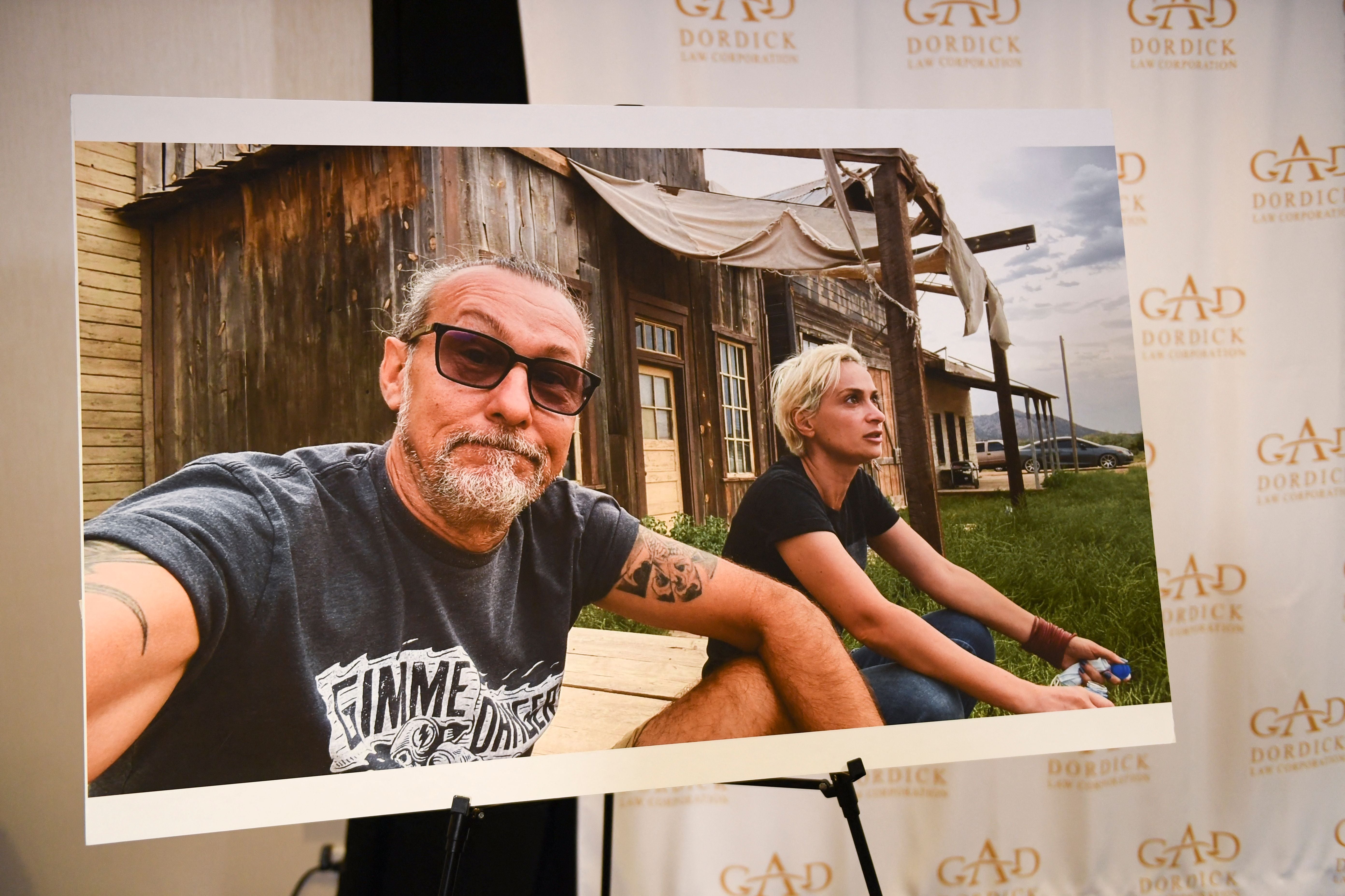 A photo of Serge Svetnoy and Halyna Hutchins is displayed after a press conference with attorney Gary Dordick (not pictured) and Serge Svetnoy, chief lighting technician for the film Rust, about a lawsuit filed after the fatal shooting on the film Rust during a press conference on November 10, 2021 in Los Angeles, California