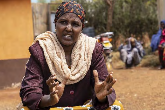 Sadia Isacko addresses the members of a local women’s group in Marsabit County, Kenya