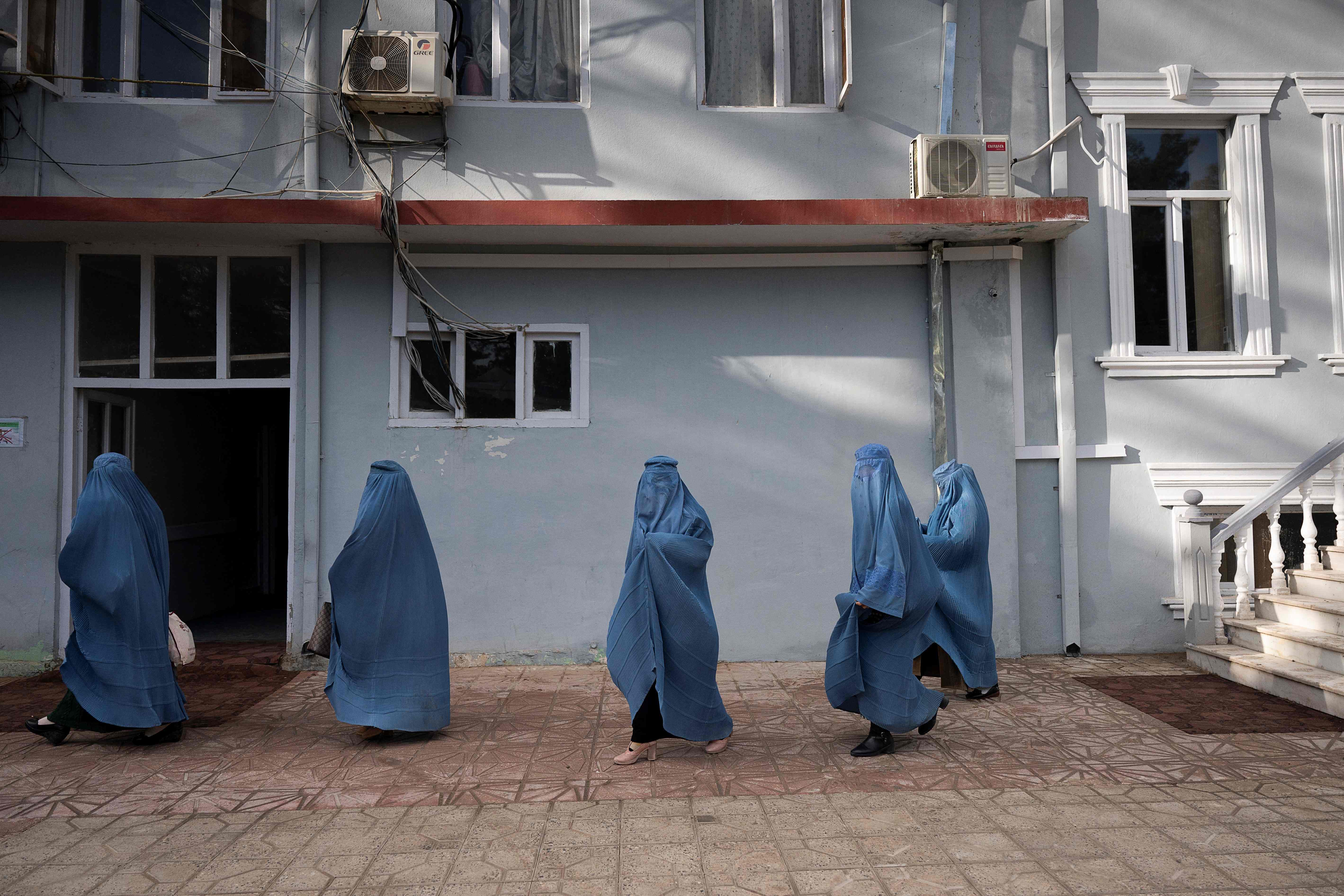 This picture taken on 17 January, 2022 shows female municipality employees, who have been able to continue working following the Taliban takeover