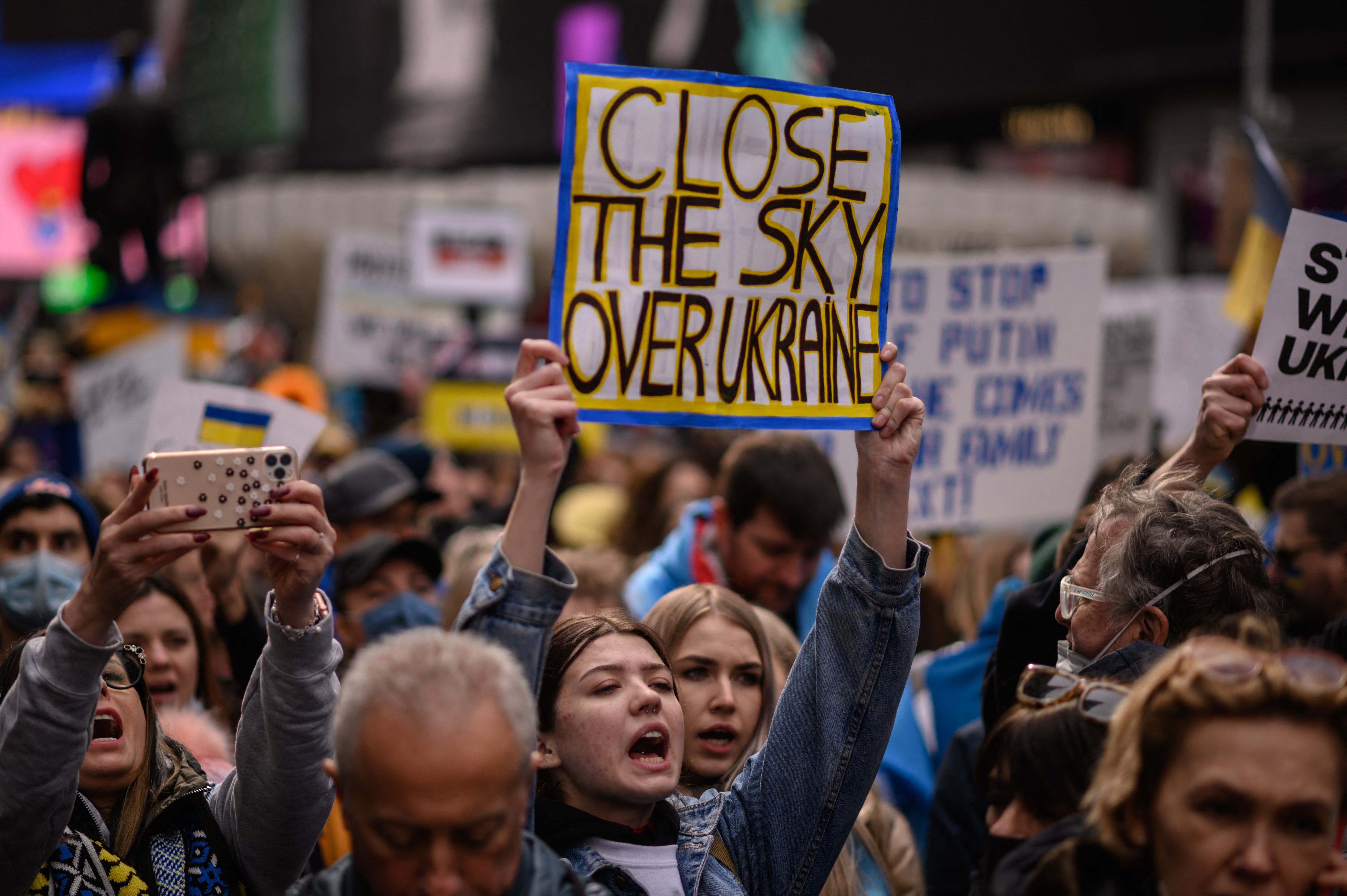 Protesters call for a no fly zone to be imposed over Ukraine at a rally in New York