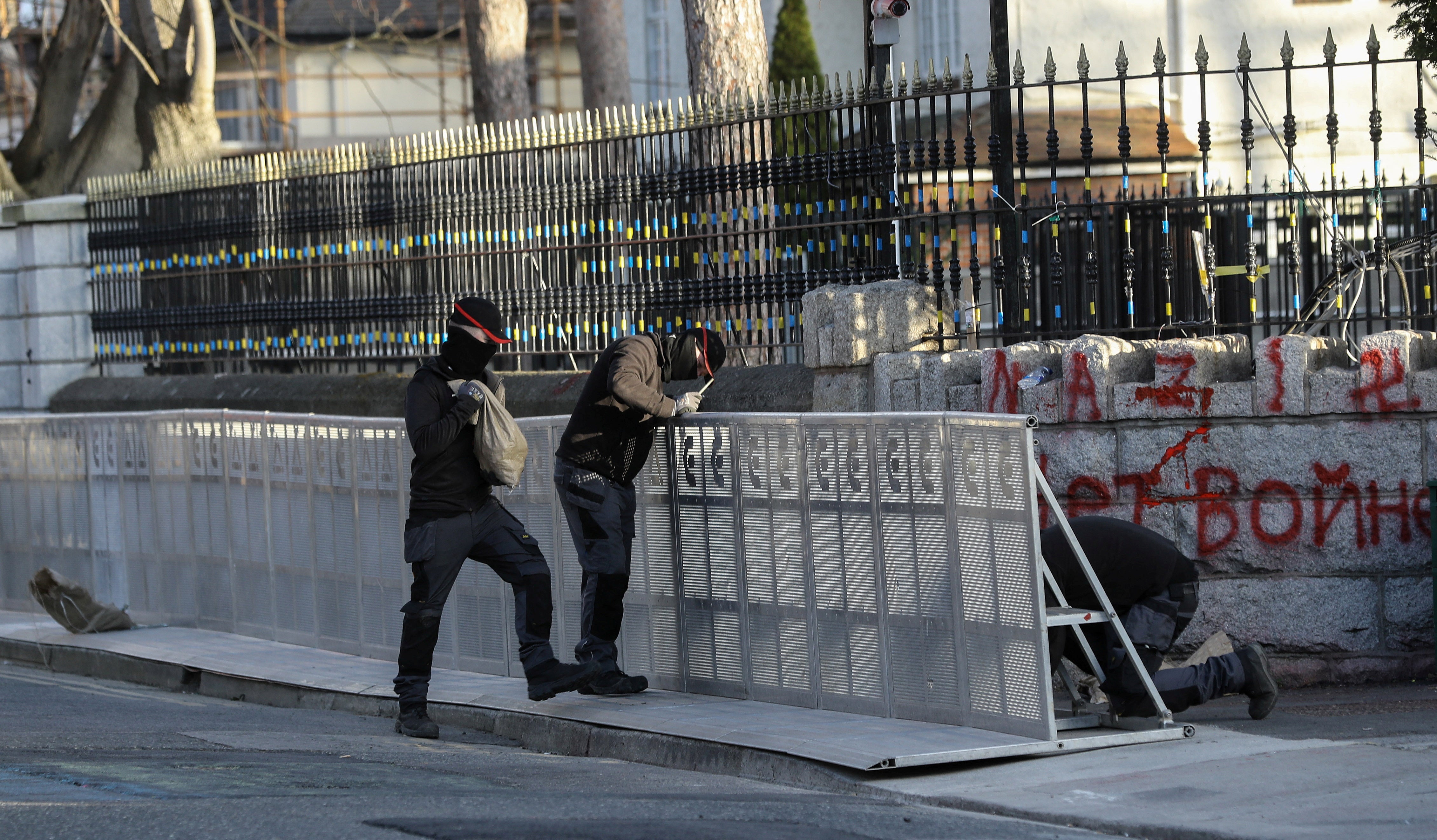 Workers assemble security barriers at the Russian Embassy in Dublin