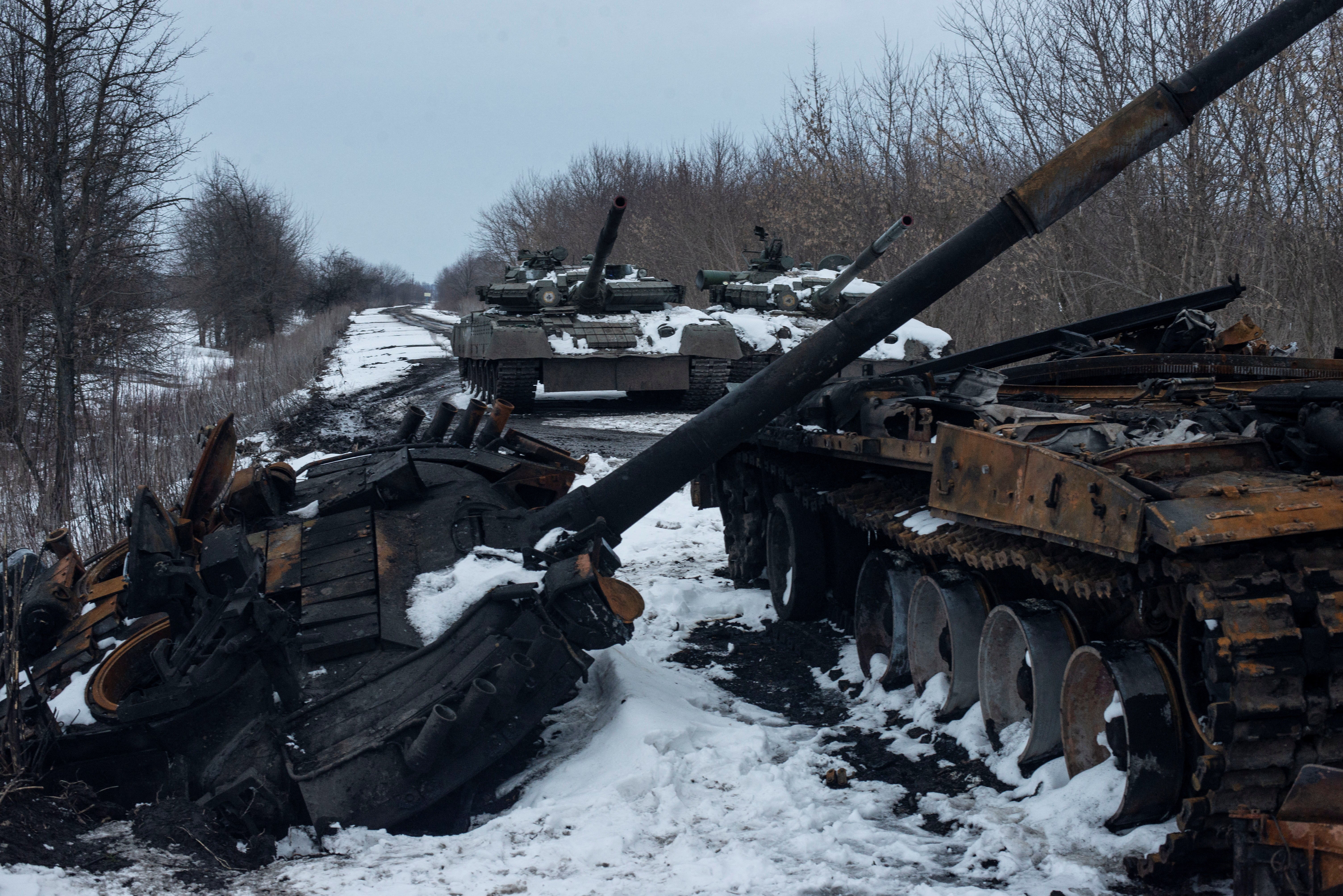 A charred Russian tank and captured tanks are seen in Sumy