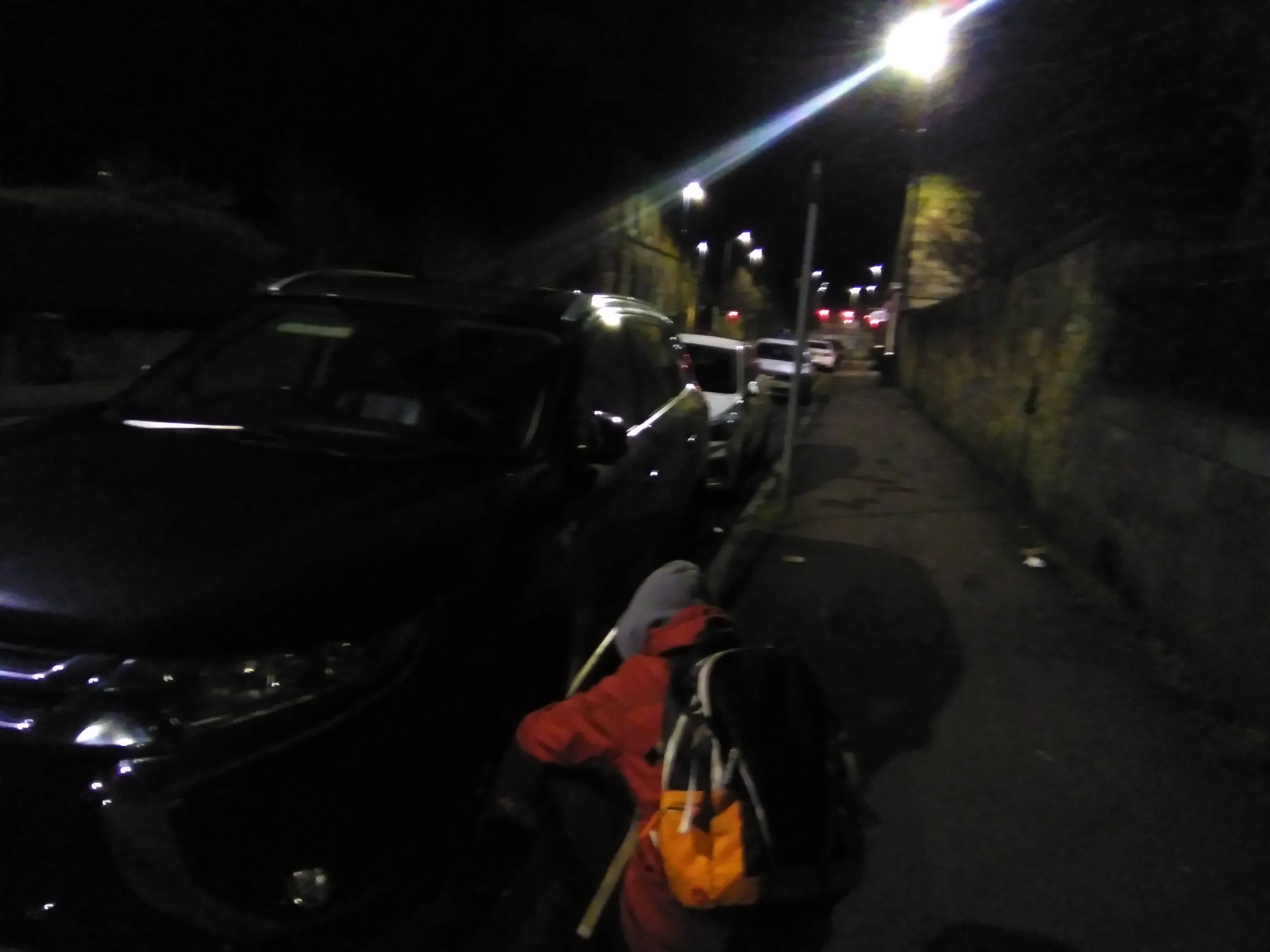 A climate activist deflates the tyres of a 4x4