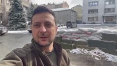 Volodymyr Zelensky winks to camera as he addresses Ukraine from outside Kyiv office