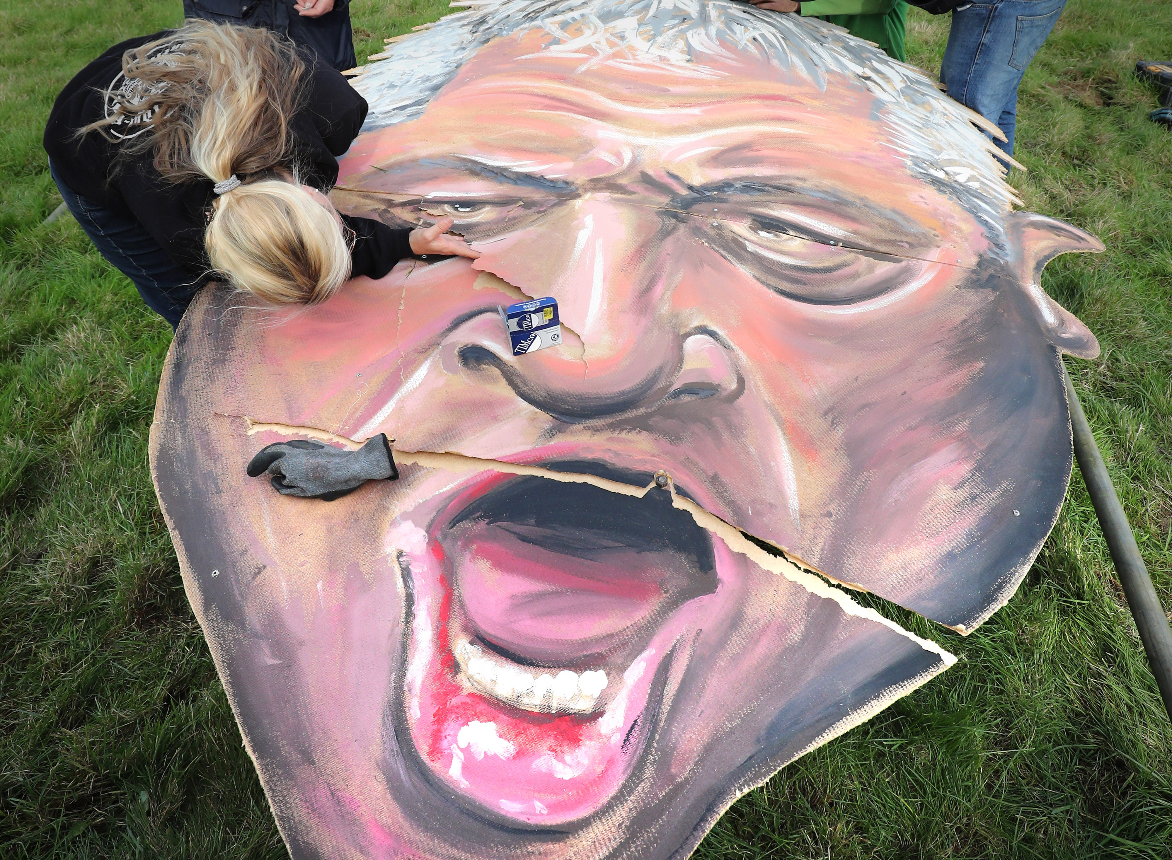 An effigy of former speaker John Bercow, made by the Edenbridge Bonfire Society, being repaired after it ripped (PA)